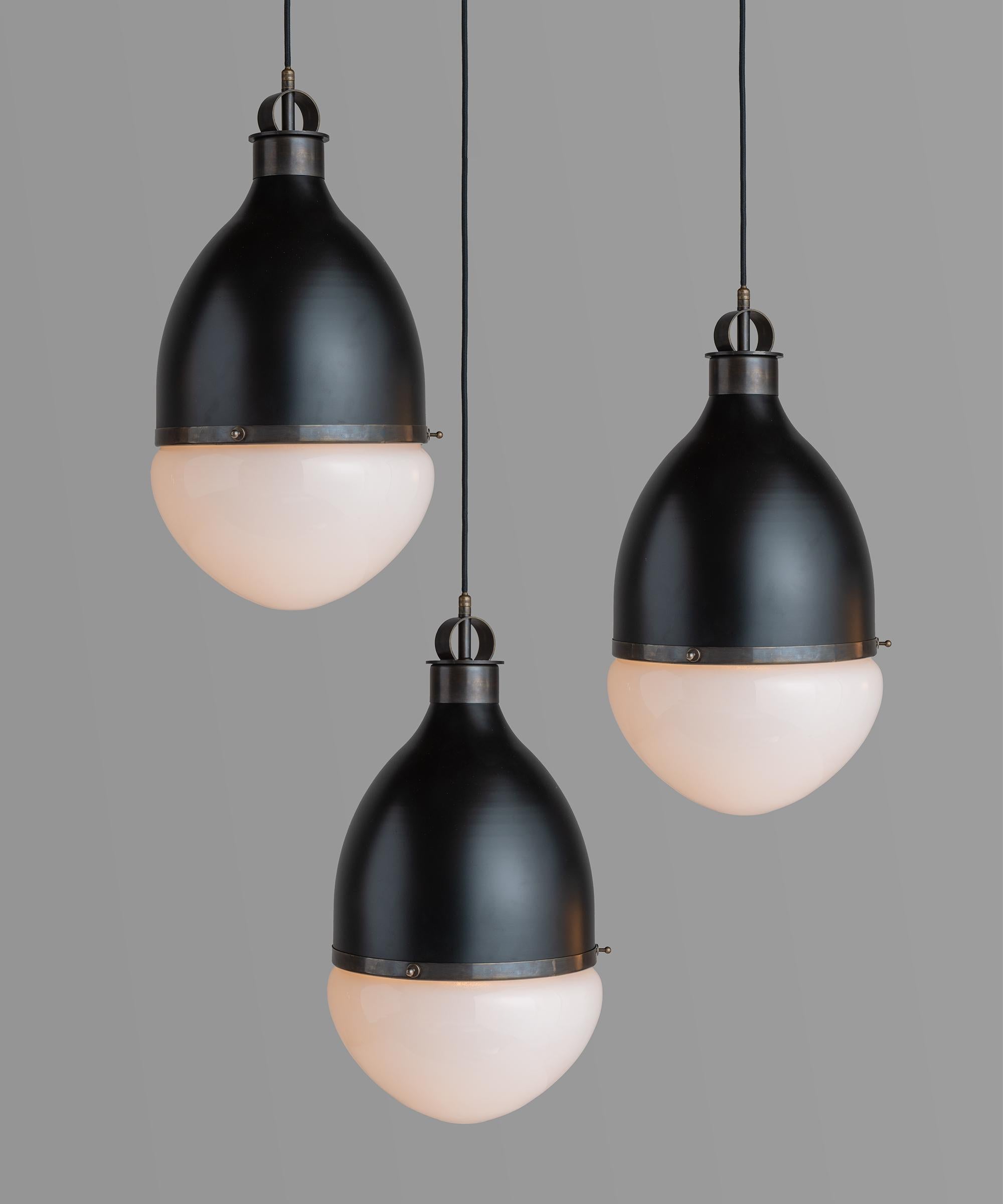 Brass & Black Metal Pendant
Made in Italy
Large scale hanging pendant with brass details and frosted glass shade.
10