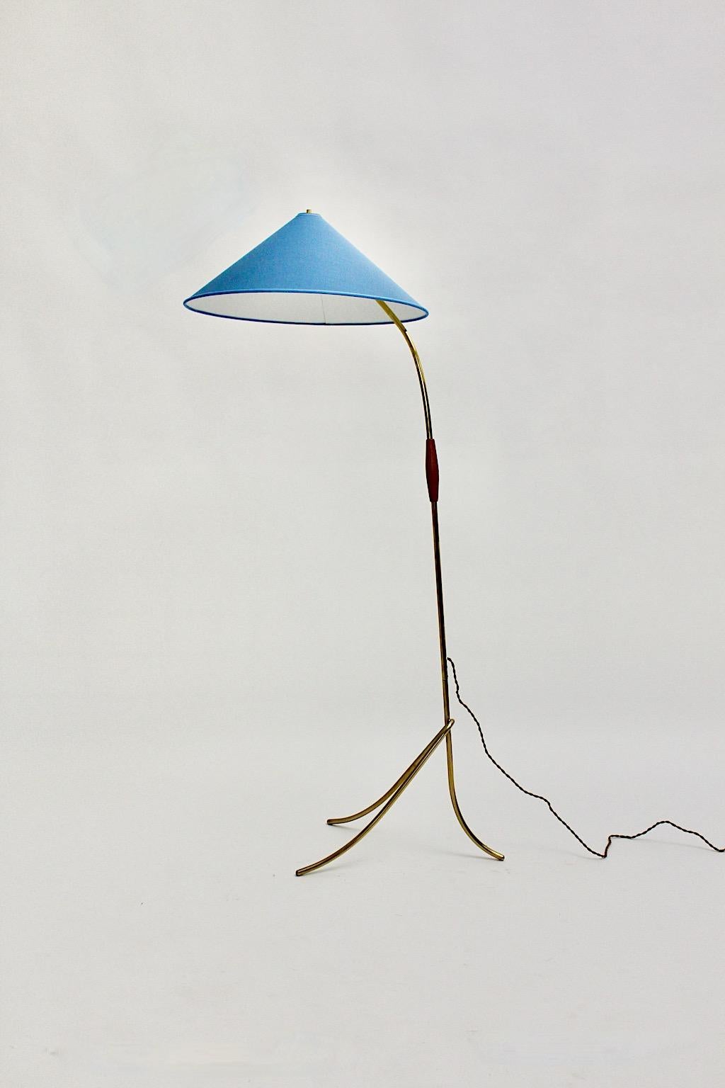 Brass blue Mid-Century Modern vintage floor lamp designed and manufactured by Rupert Nikoll, 1950s, Austria.
The company Rupert Nikoll was a renowned lamp manufacturer during the midcentury era in Vienna.
The stem was made of brass tube with a