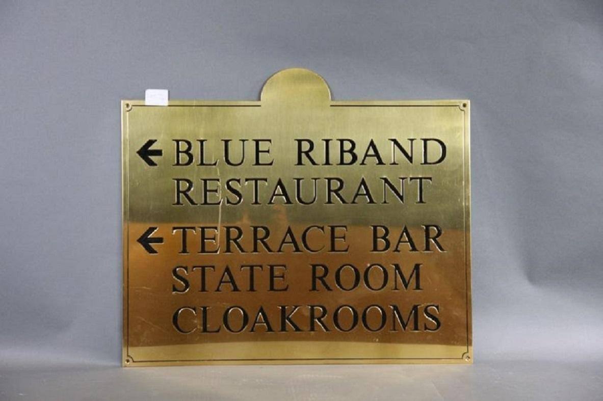Brass with enamel filled letters trade sign with blue riband restaurant and terrace bar, state room, and cloakroom. Possibly from an ocean liner.