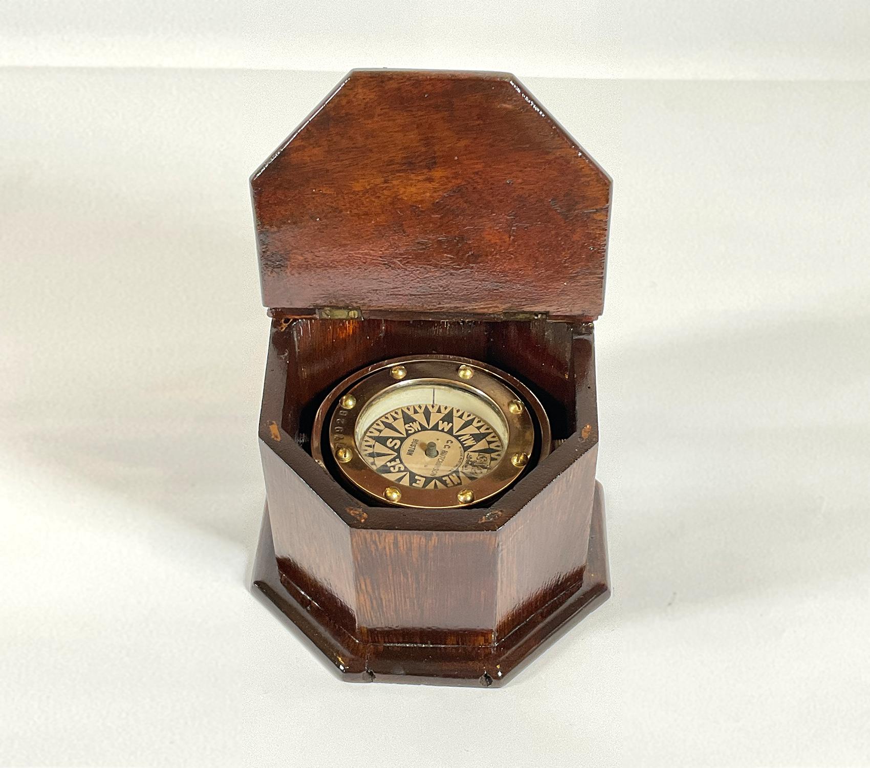 Highly polished 19th century boat compass by Ritchie, Boston USA. Compass card has ship chandler name of CC Hutchinson of Boston. The compass is fitted to an 8 sided varnished mahogany binnacle box with slanted lid and brass hinge. 

Weight: 3