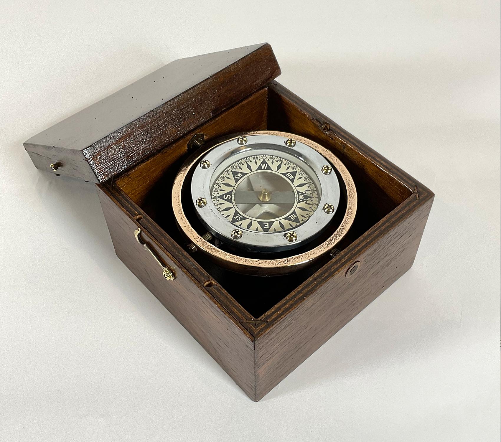 Solid brass boat compass on gimbal by Dirigo of Seattle Washington as marked on the compass card.

Weight: 2 lbs
Overall Dimensions: 4