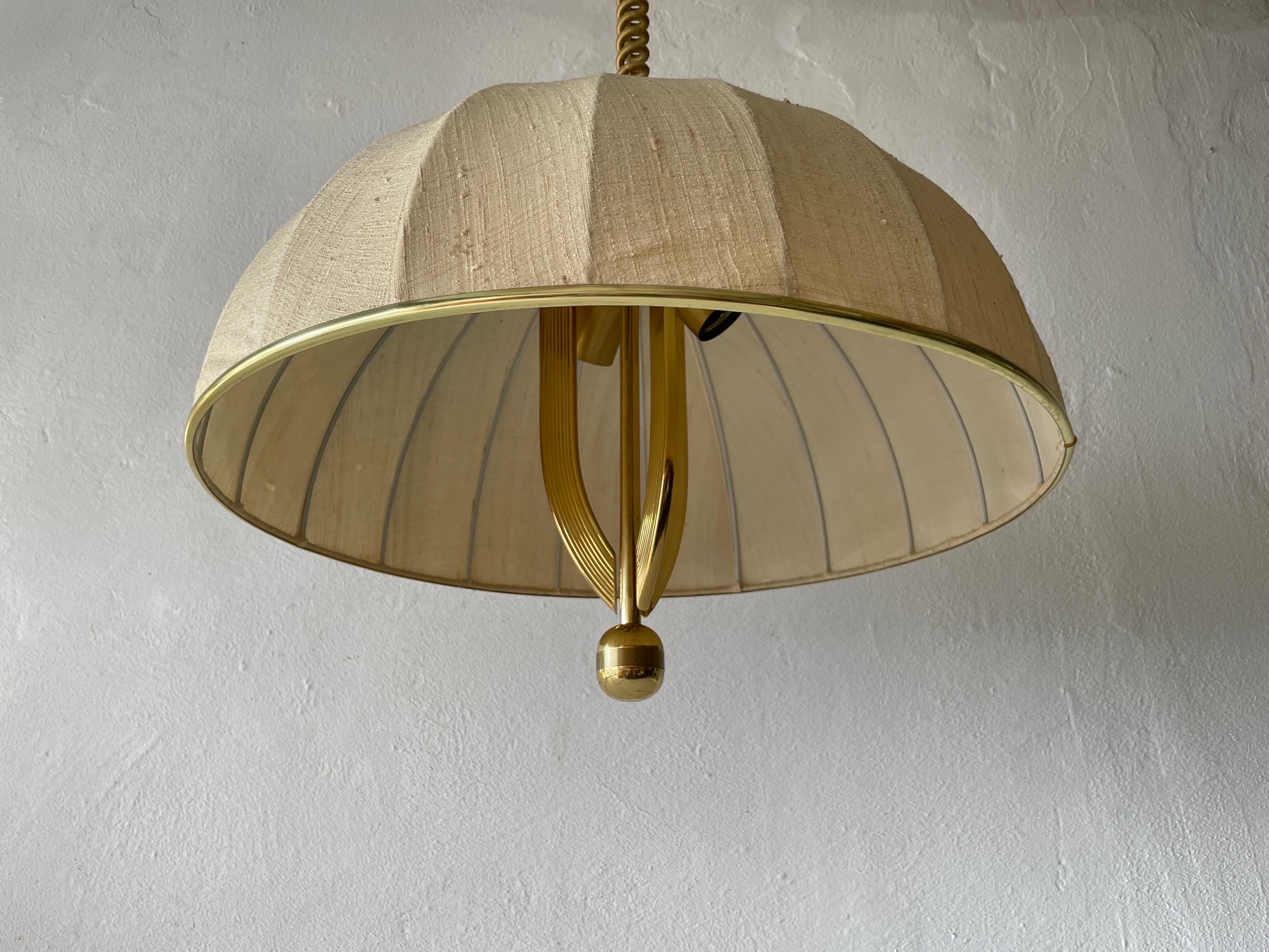 Brass Body & Fabric Shade Mid-Century Modern Pendant Lamp by WKR, 1970s, Germany

Brass body & fabric shade
Manufactured in Germany

This lamp works with 3 x E27 light bulbs.

Measurements: 
Height between 80 cm and 110 cm
Lampshade