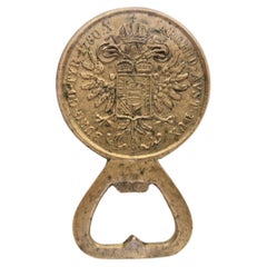 Brass bottle opener featuring a Maria Theresa thaler