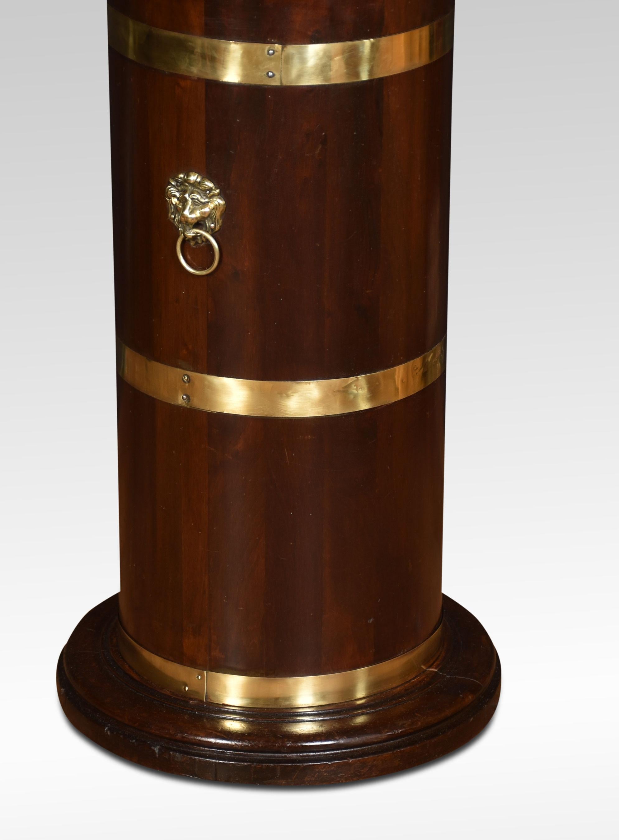 Regency style mahogany and brass bound circular stick stand, with lions mask handles, on a shaped base, having the original metal liner.
Dimensions
Height 26 Inches
Width 14.5 Inches
Depth 14.5 Inches.