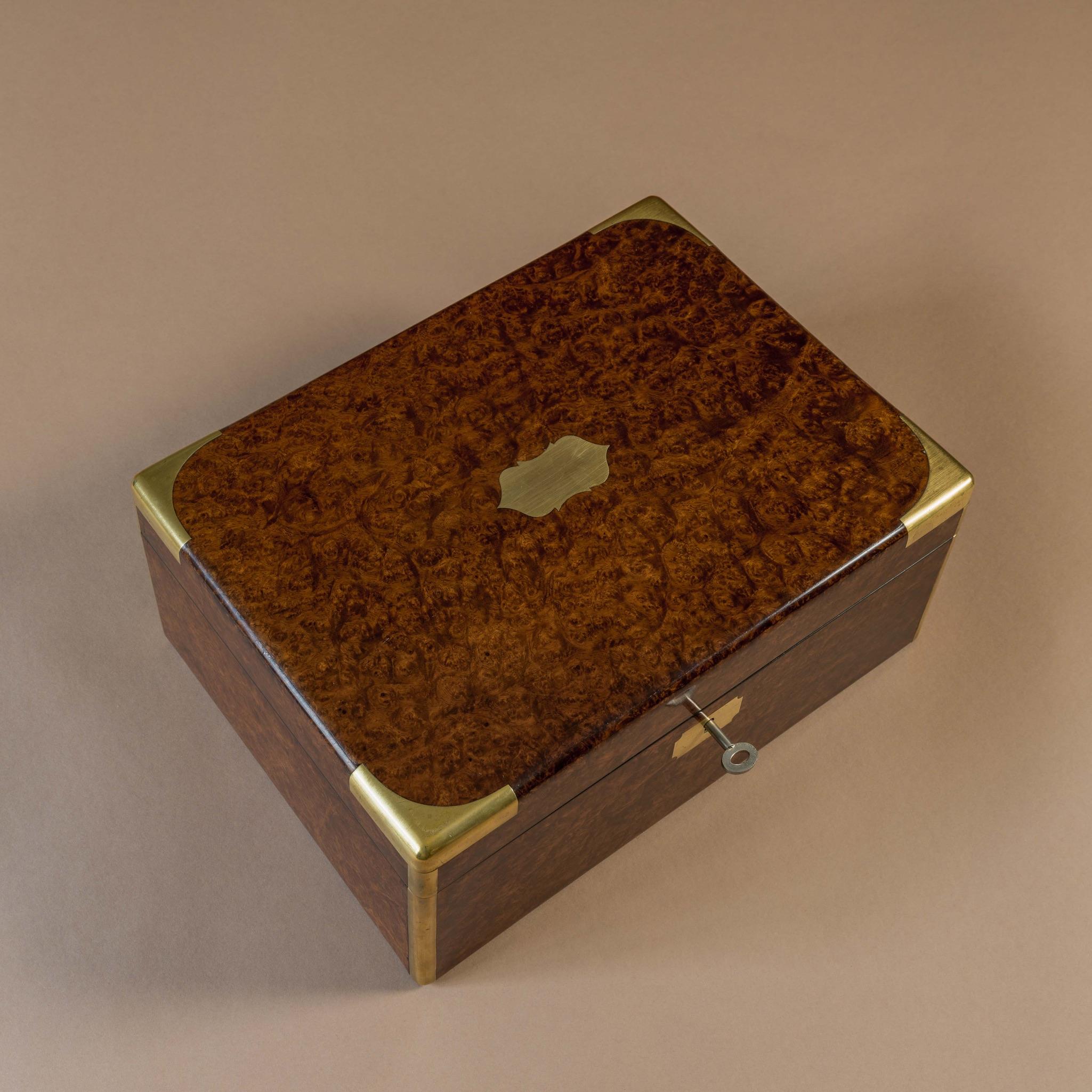 A superb brass bound walnut box Circa 1910 that has been re-lined in cedar at some point and converted to a humidor. Has a cedar divider, a brass cased humidification unit and a rubber seal to help maintain humidity. Also includes a
