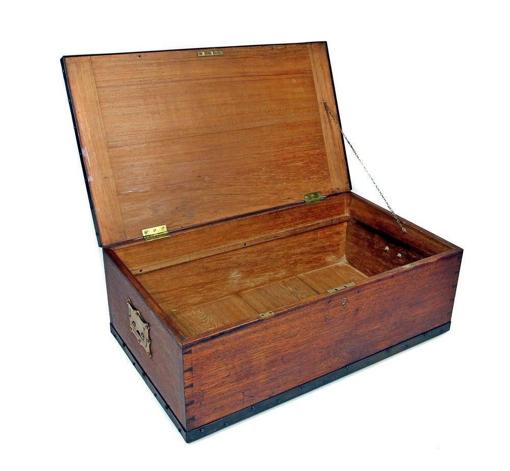 Brass and steel bound teak Campaign trunk with recessed brass carrying handles.