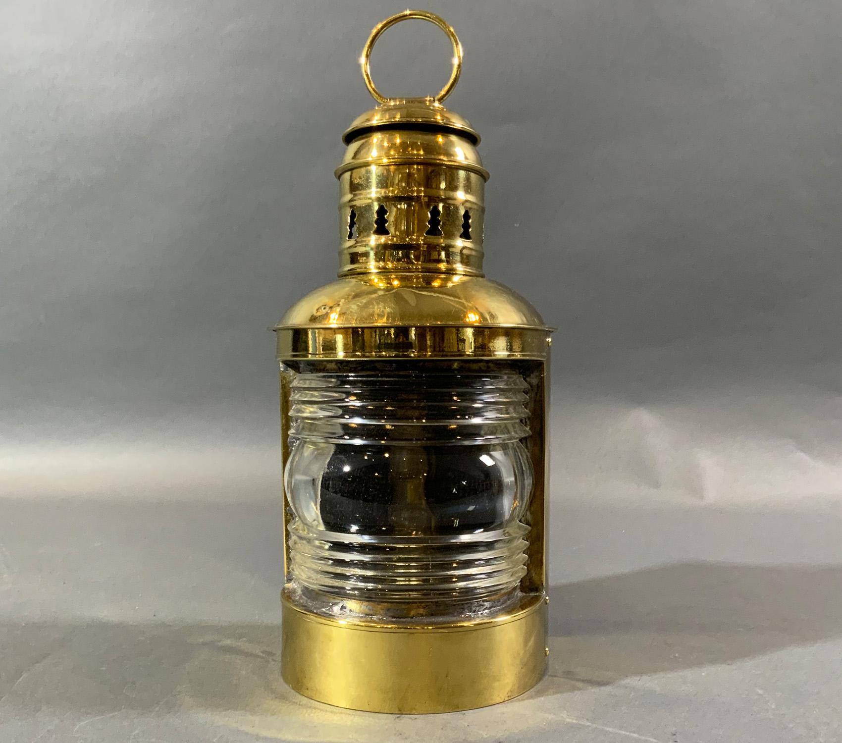 Solid brass ships masthead lantern with Fresnel glass lens. Fitted with its original burner. Mounting flange on rear. Lantern is by Perkins Marine Lamp Corporation of Brooklyn New York. Vented top and carry ring.

Weight: 3 LBS
Overall