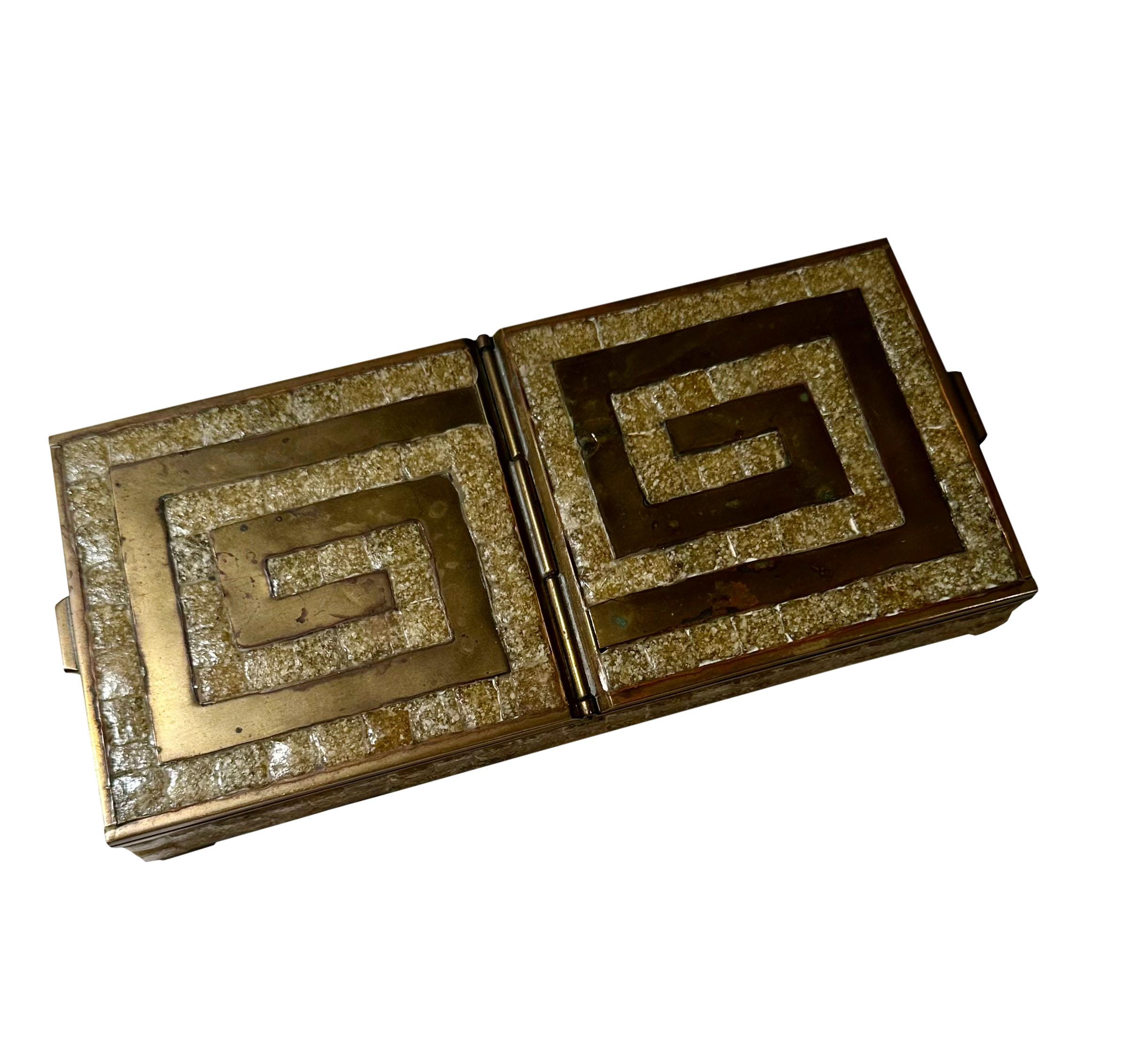 A wonderful brass box with a Greek key design in a marble or stone. The interior is lined in wood and has two compartments. It is very pretty. Circa 1940s, Mexico marked on bottom. 
