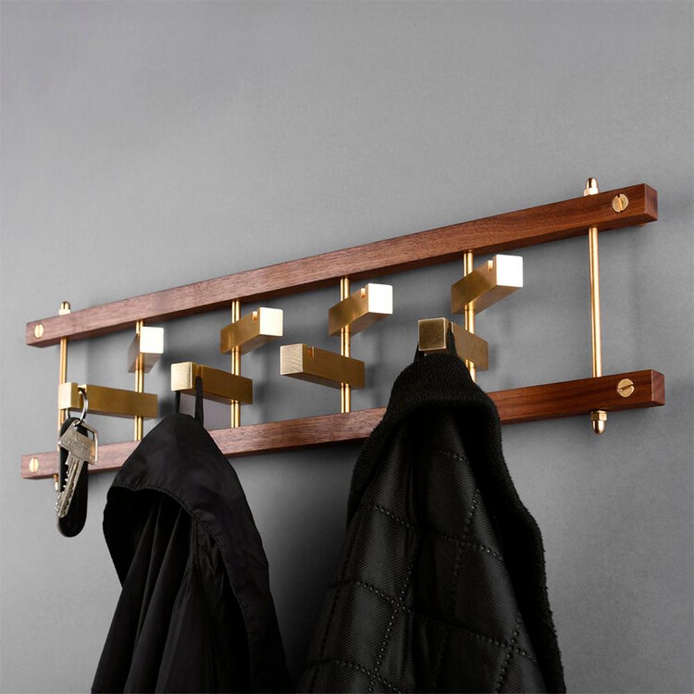 Brass Brick Coat Rack by OxDenmarq
Dimensions: D 8 x W 49.5 x H 13 cm
Materials: Brass

OX DENMARQ is a Danish design brand aspiring to make beautiful handmade furniture, accessories and lighting in natural high-quality materials in fair prices.