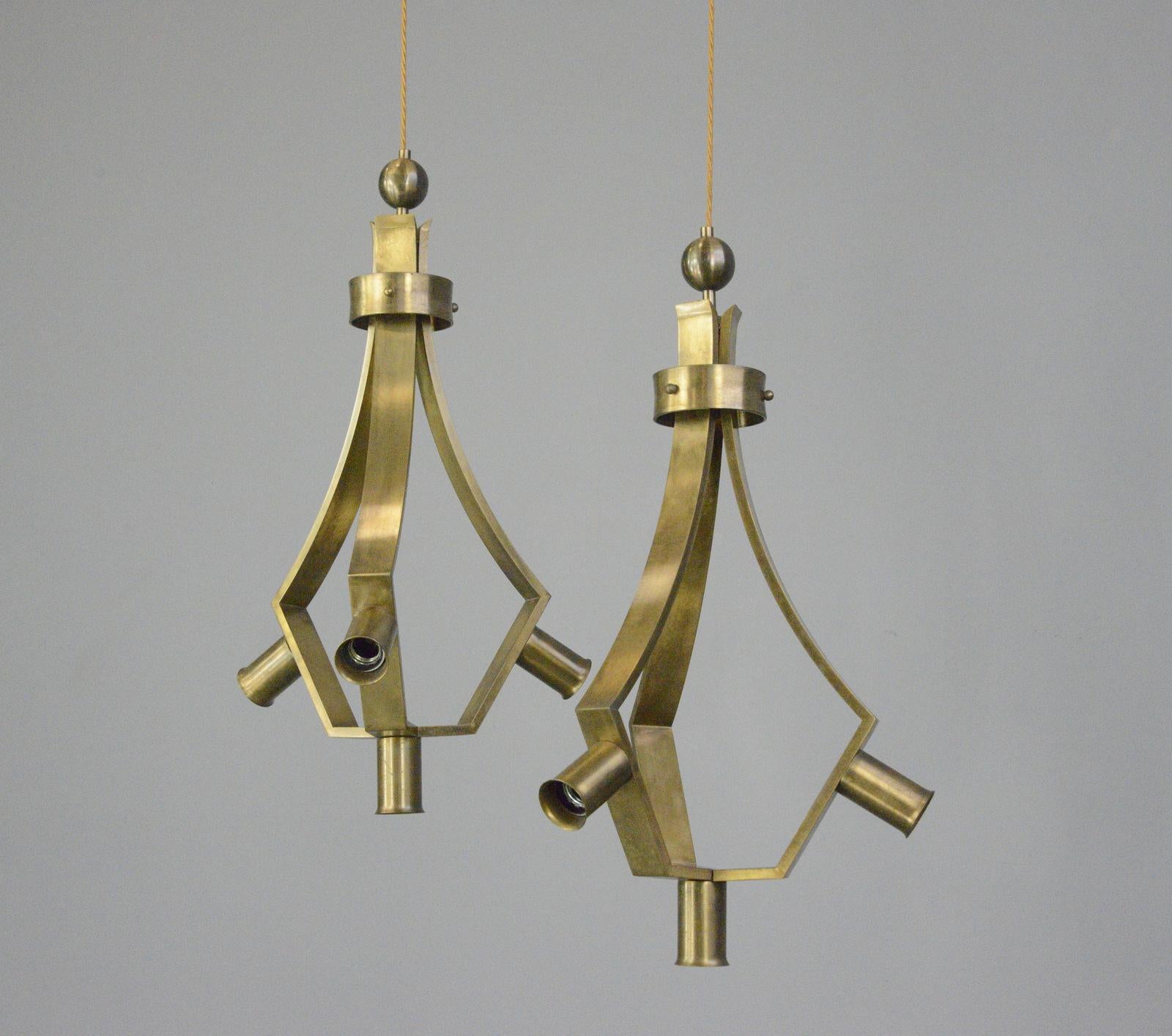 Brass Brutalist Pendant Lights by Schonwandt circa 1970s

- Takes 4x E27 fitting bulbs
- Solid brass
- Suspends from the cable
- German ~ 1970s
- 36cm wide x 70cm tall

Condition Report

Fully rewired with modern electrical components,