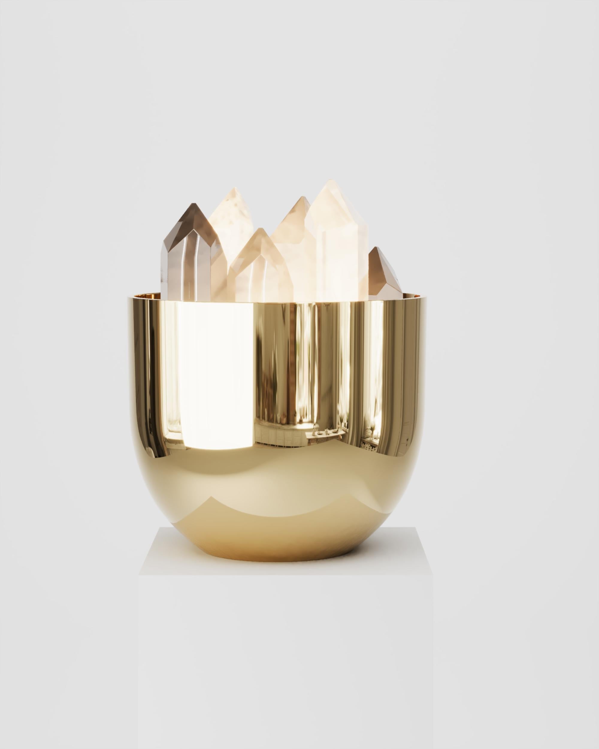 Brass Buca Cristal Table Lamp by Studio Orth
Dimensions: W 22 x D 22 x H 19 cm
Materials: Cast metal and Rock crystal
Finishes: Polished Cast Brass and Milky resin. 

All our lamps can be wired according to each country. If sold to the USA it will