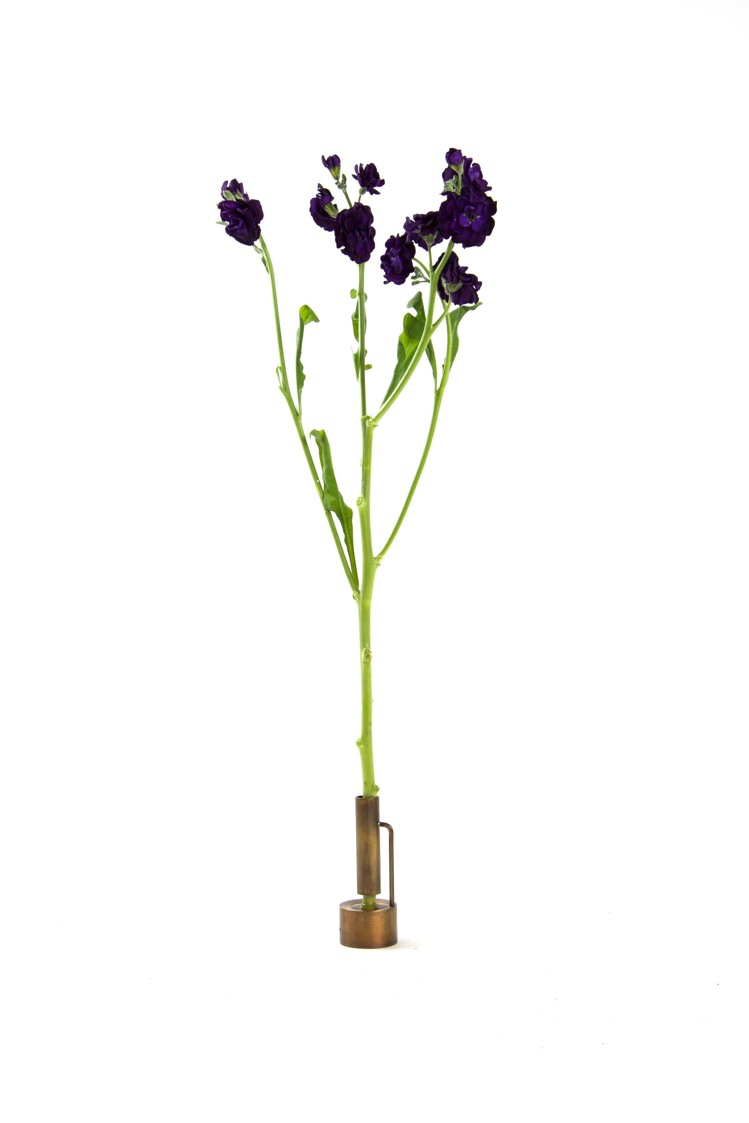 Brass bud vase by Gentner Design
Dimensions: D 5 x W 5 x H 10 cm
Materials: dull tarnished brass

Each of these delicately, handcrafted Bud Vases is perfect as an individual home accessory or whimsical series. Made of brass and hand tarnished,