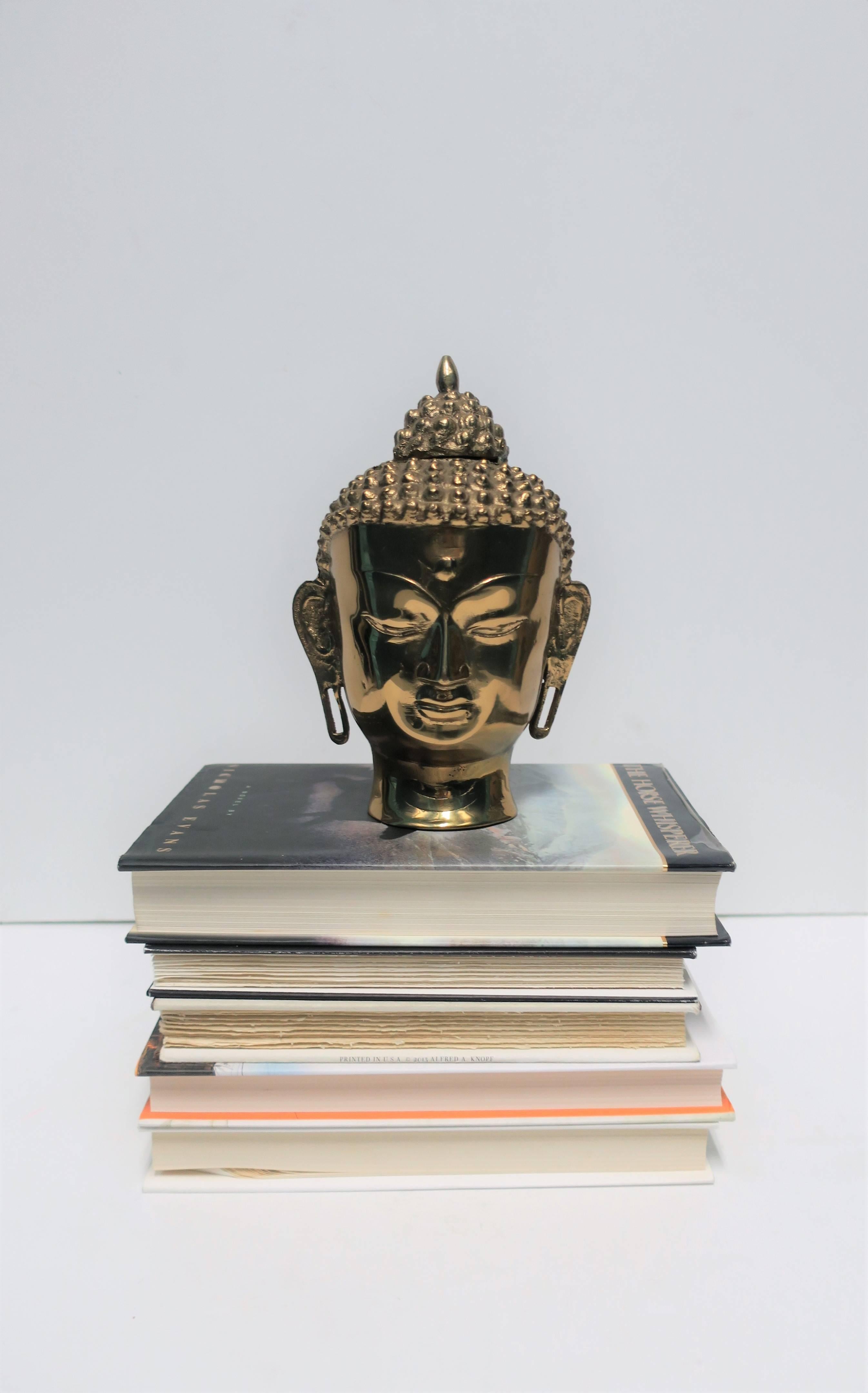 A decorative brass Buddha head. 

Measurements: 4.5 in. D x 5.50 in. W x 8 in. H

Item available here online. By request, item can be made available by appointment to the Trade in New York.
  