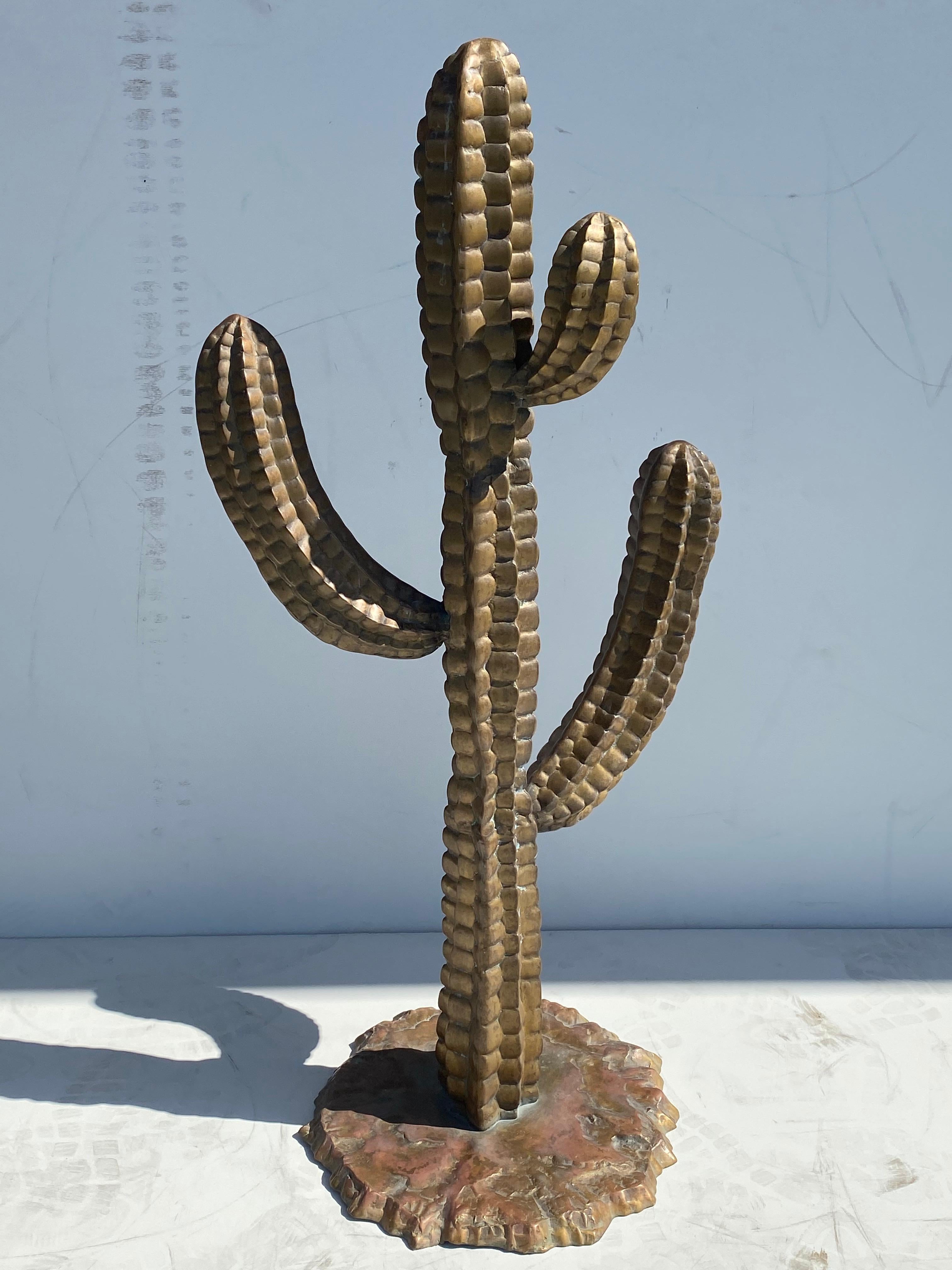 Brass cactus sculpture.