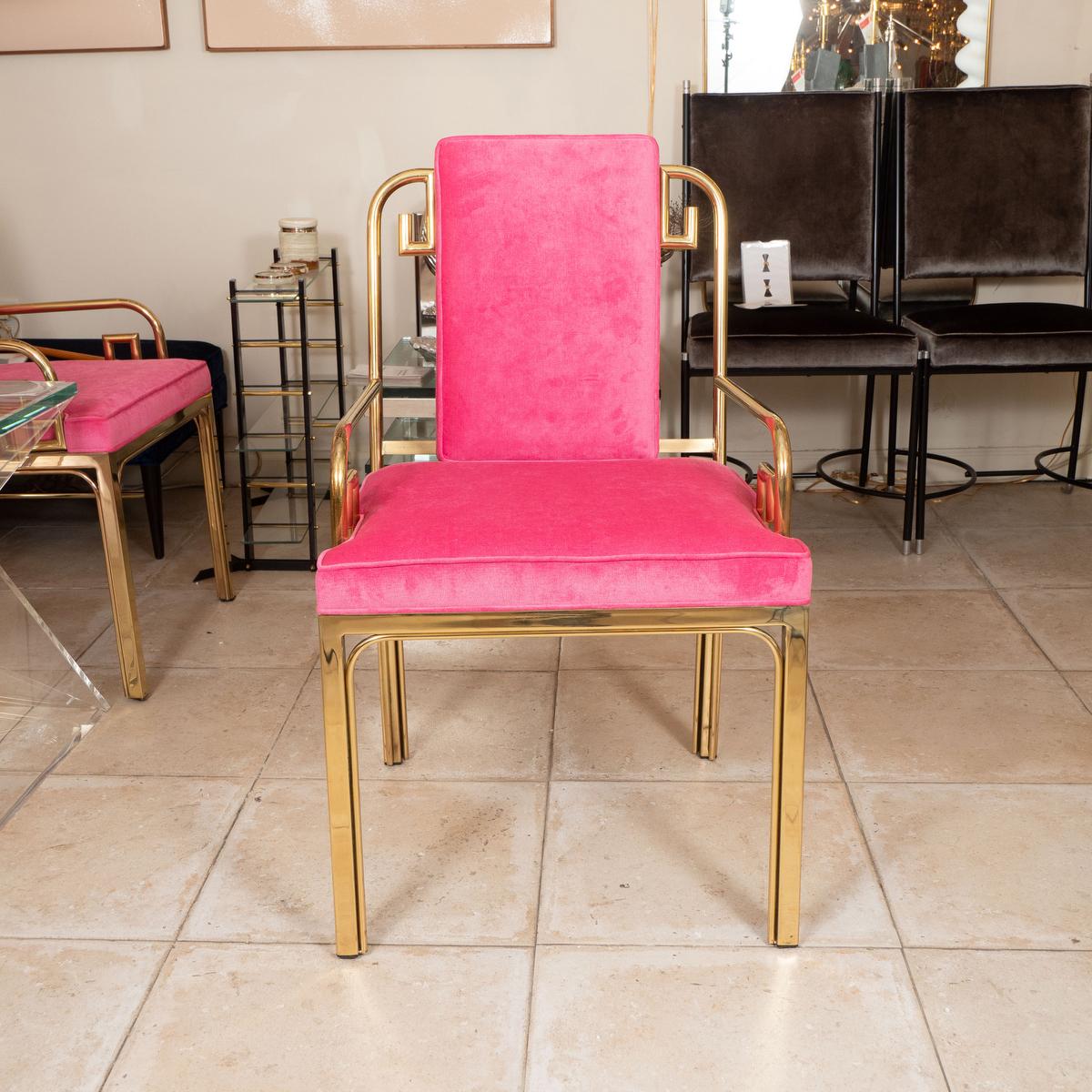Brass campaign style chair with upholstered seat and back. 
