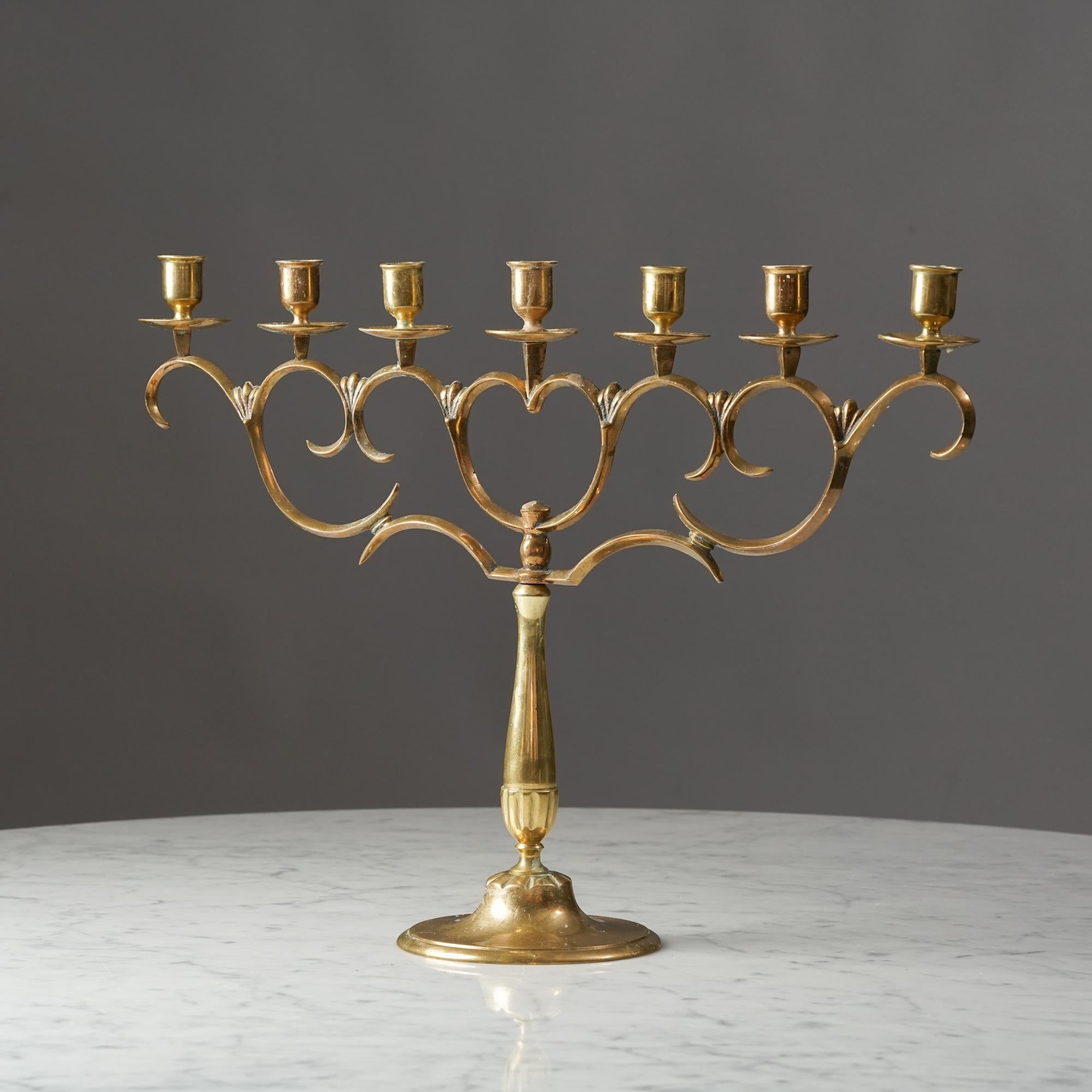 Brass candelabra by Paavo Tynell. Made in Finland by Taito in the 1920/1930s. This piece is a classic Paavo Tynell chandelier for Taito Oy, which was made in different sizes. 

Marked '162'. 

