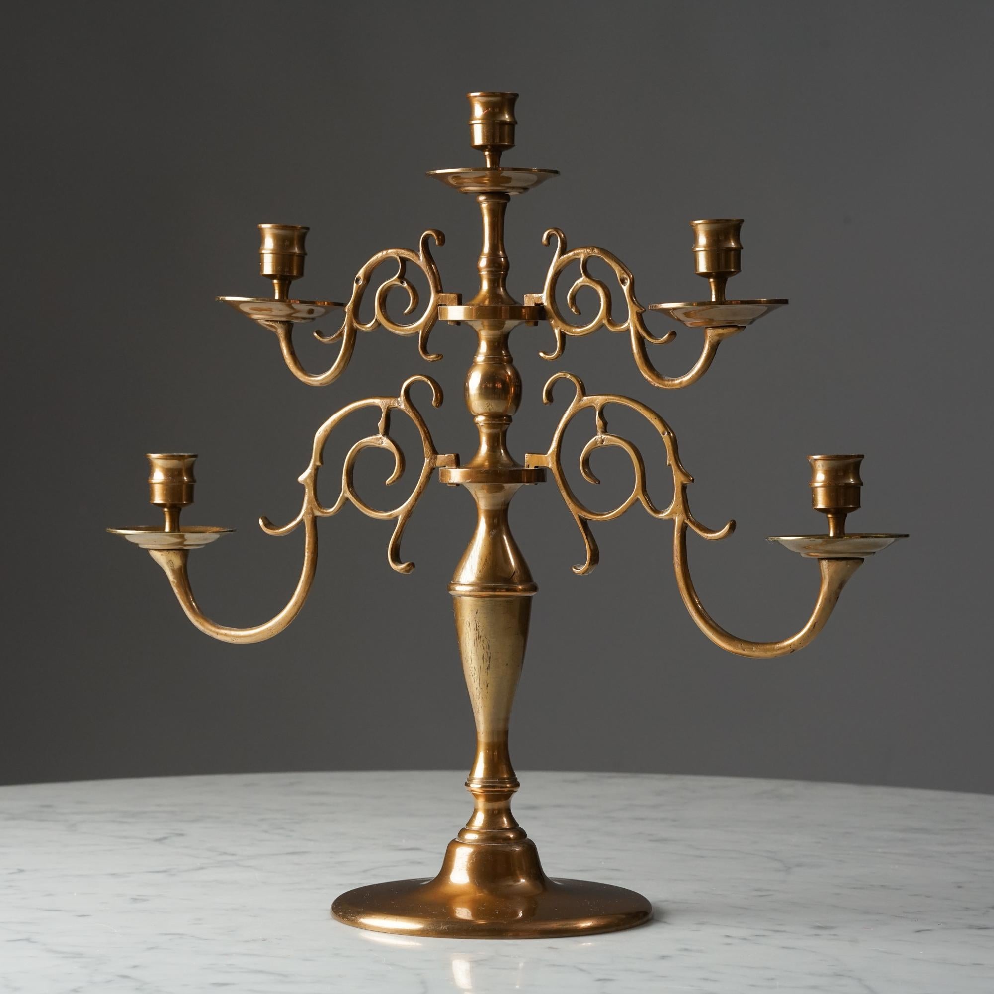 Rare brass candelabra model 1503 by Taidetakomo Hakkarainen, Finland, 1940s.
Solid Brass. 
Measurements: width 40.5 cm, depth 15 cm (bottom diameter), height 38.5 cm.