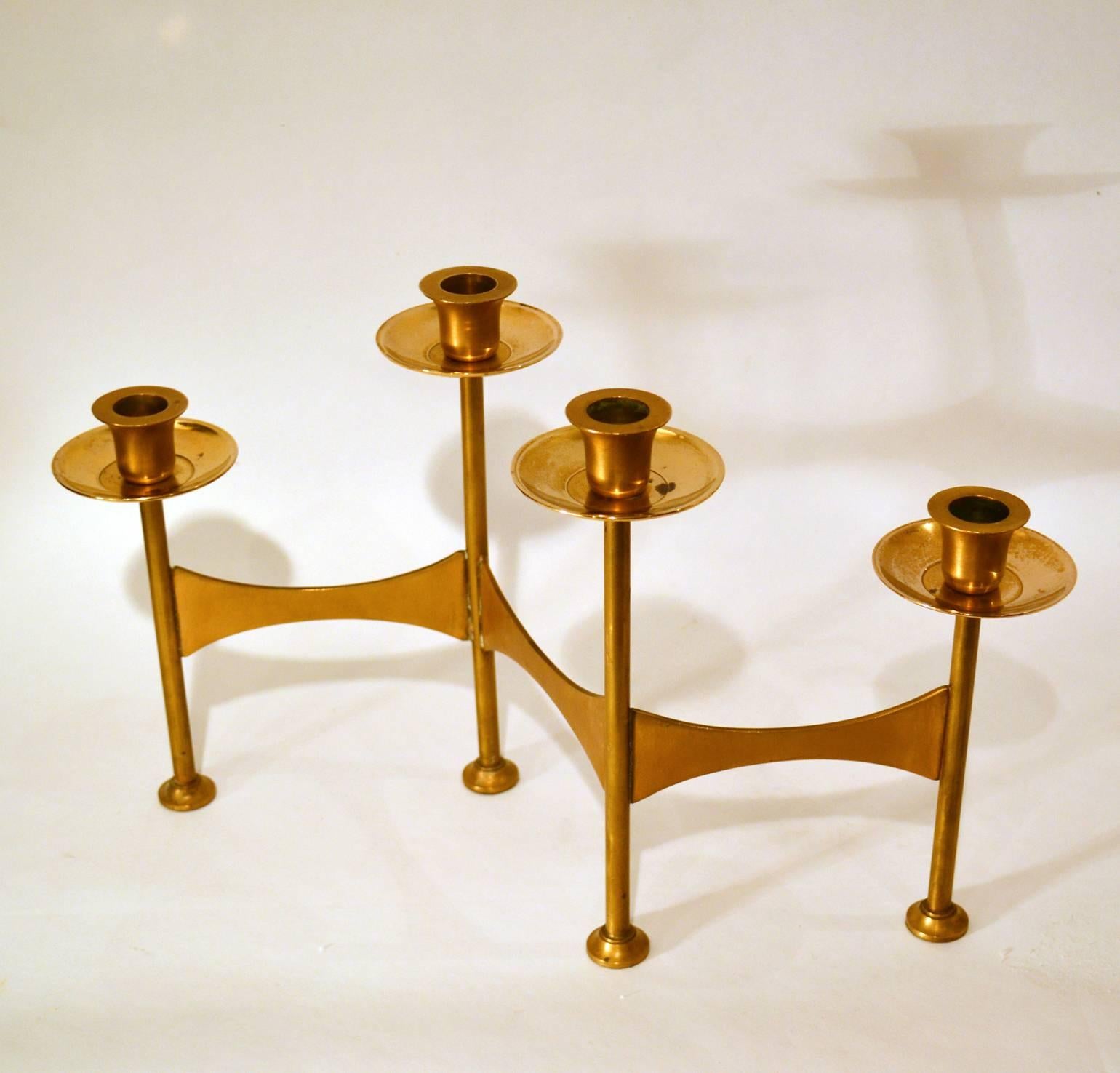 Danish candelabra for four candles on alternating heights is created in zigzag stationary positions, made in brass in the 1970s.