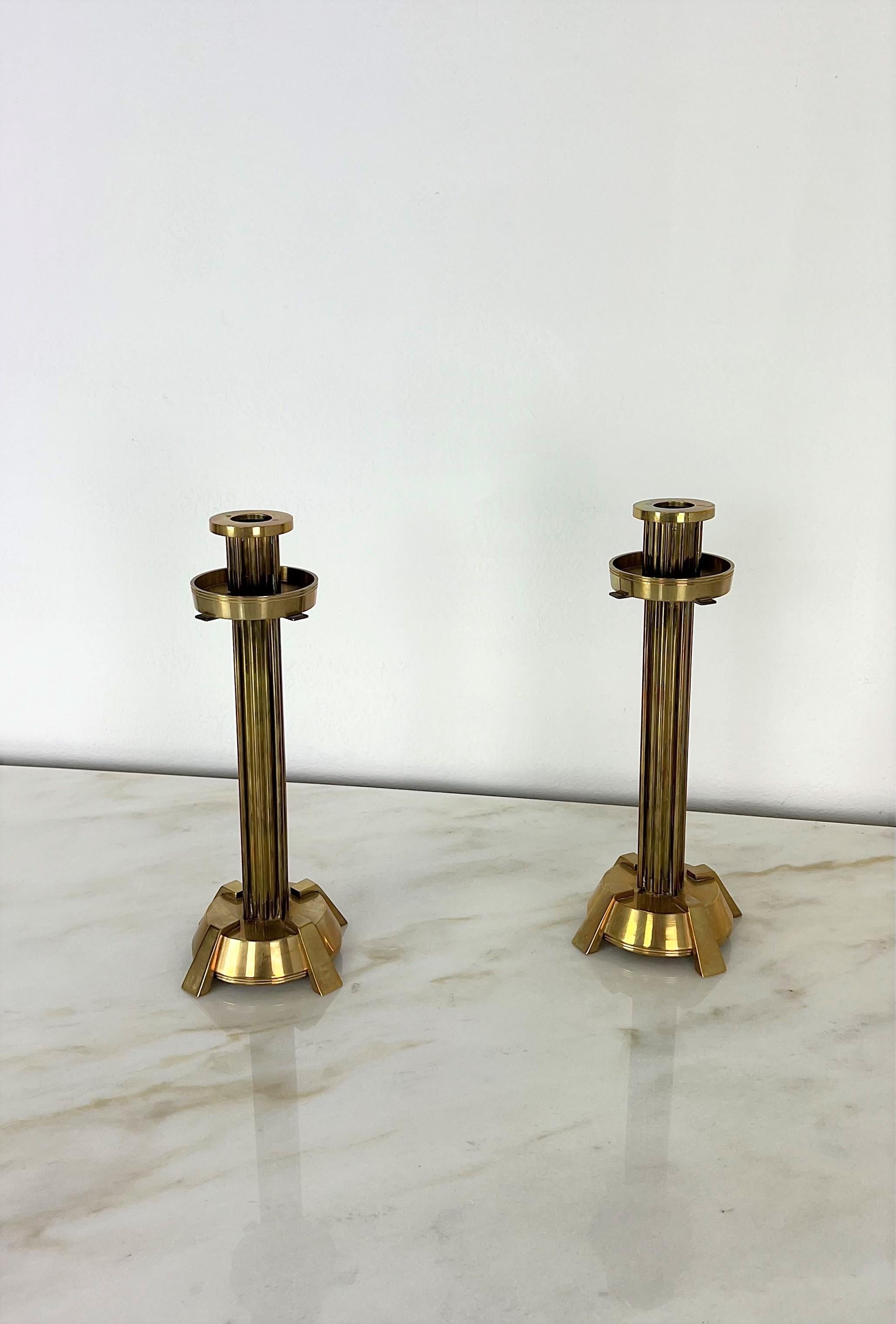 Elegant Set of 2 monocera / candelabra of considerable size produced in Italy in the 70s, made entirely of brass and adaptable to any environment.