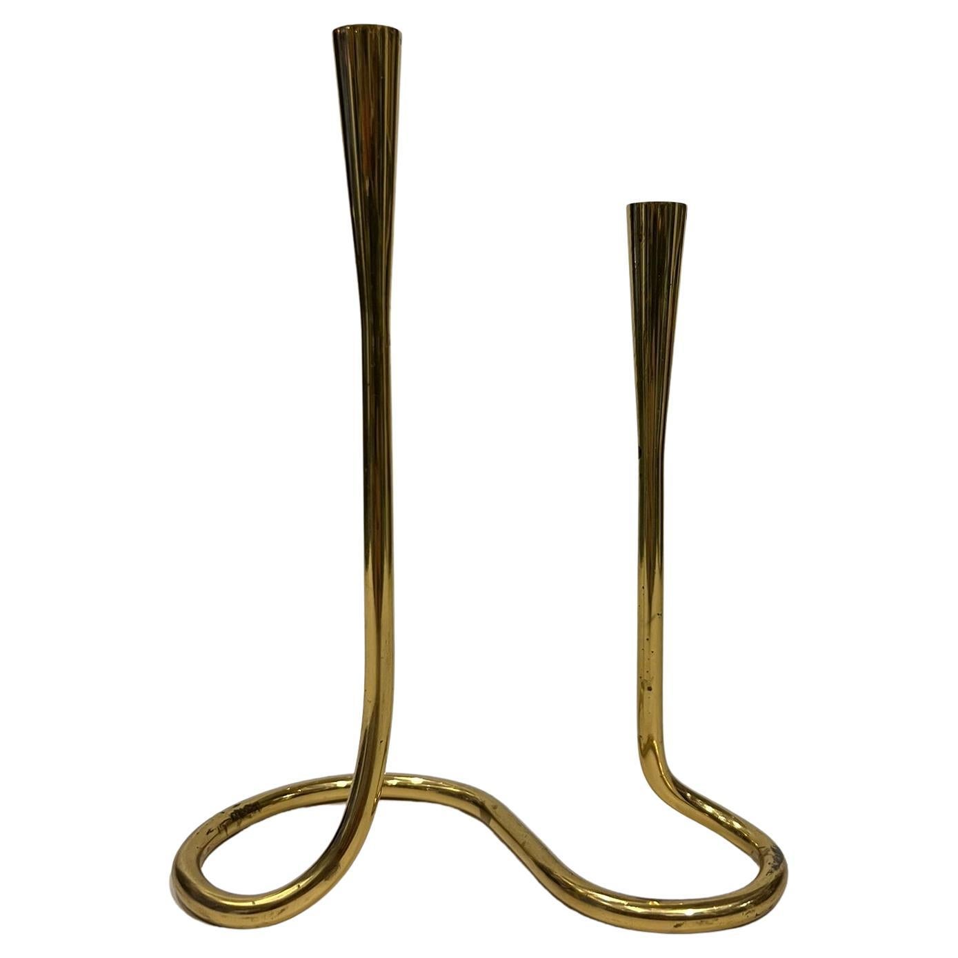 Serpentine brass candlestick for Illums Bolighus 1960s, after Danish design, produced in Germany.