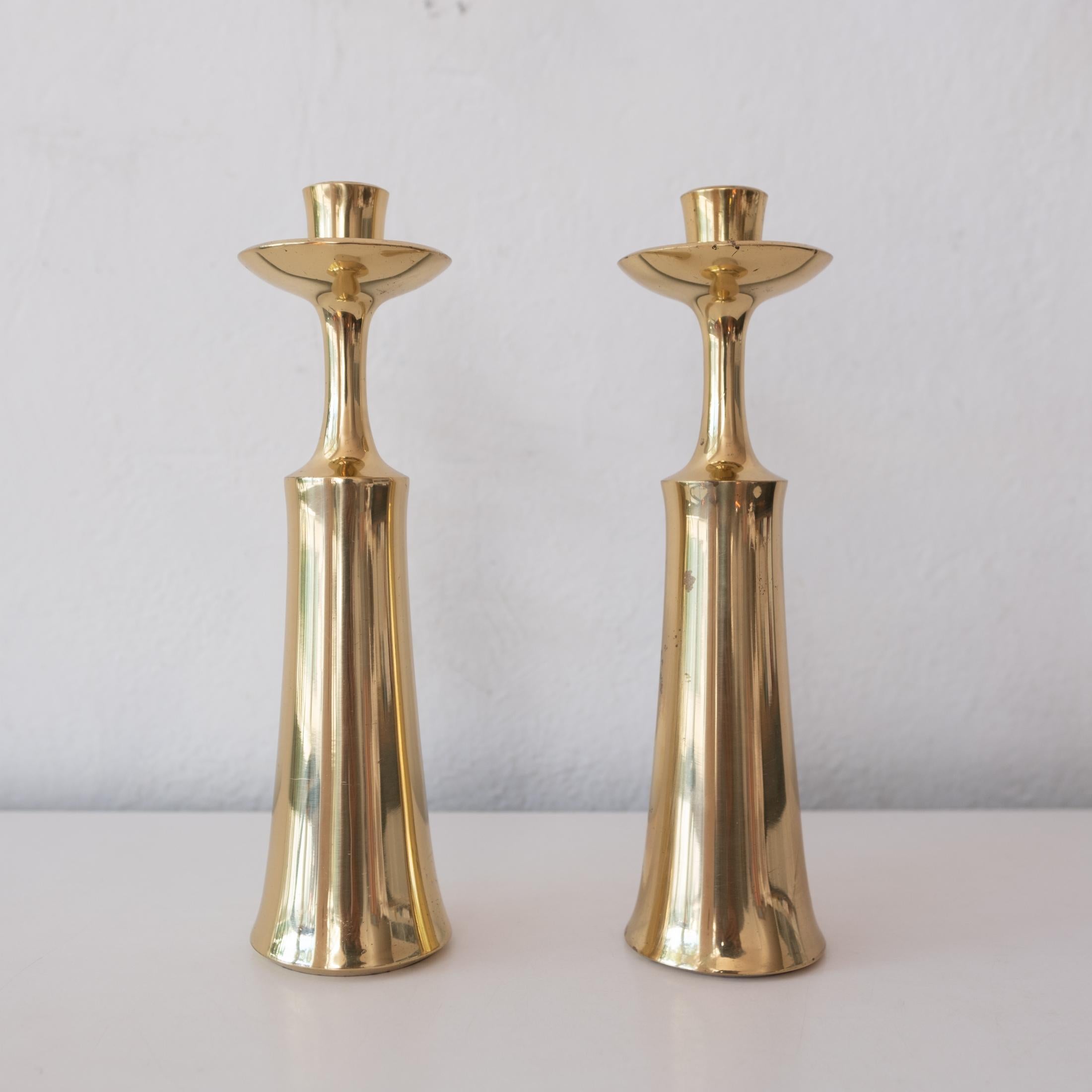 A pair of solid brass candlesticks by Jens Quistgaard for Dansk. Signed on the interior. Made in Denmark, 1950s. 
