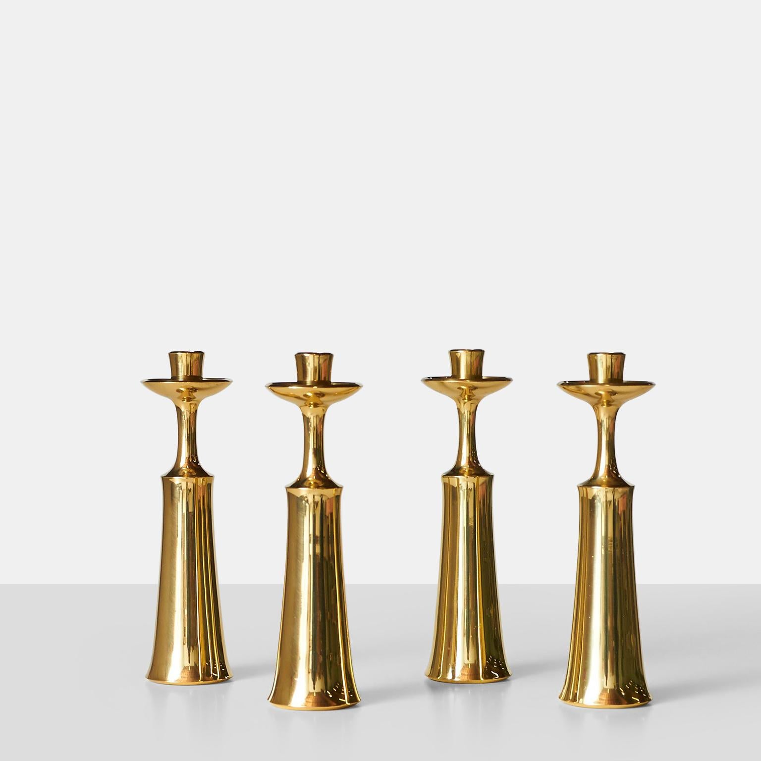 Candlesticks made of brass and stamped accordingly.

Priced per pair and two pairs are available.