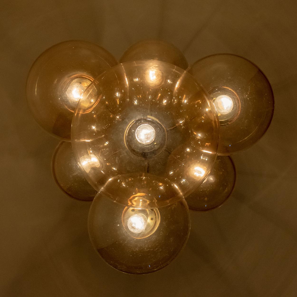 Absolutely amazing huge ceiling mount pendant light fixture with seven different sizes of globes or spheres by Limburg Glashütte. With hand blown glass pendants. Very suitable for building beautiful compositions. A rare opportunity which you don’t