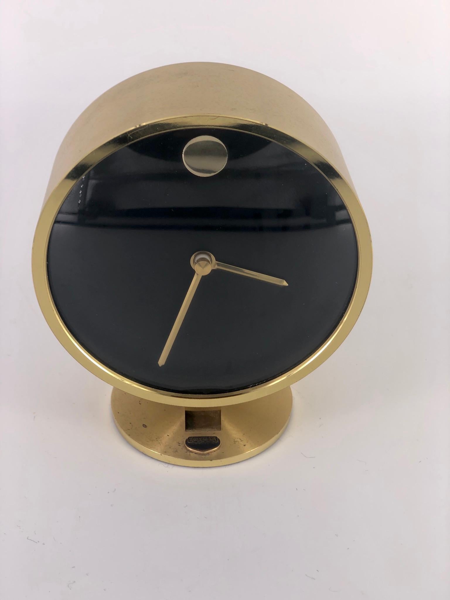 Polished brass table clock design by Howard Miller, circa 1980s, comes with small plaque it was awarded to a Toyota dealership, battery operated German movement.