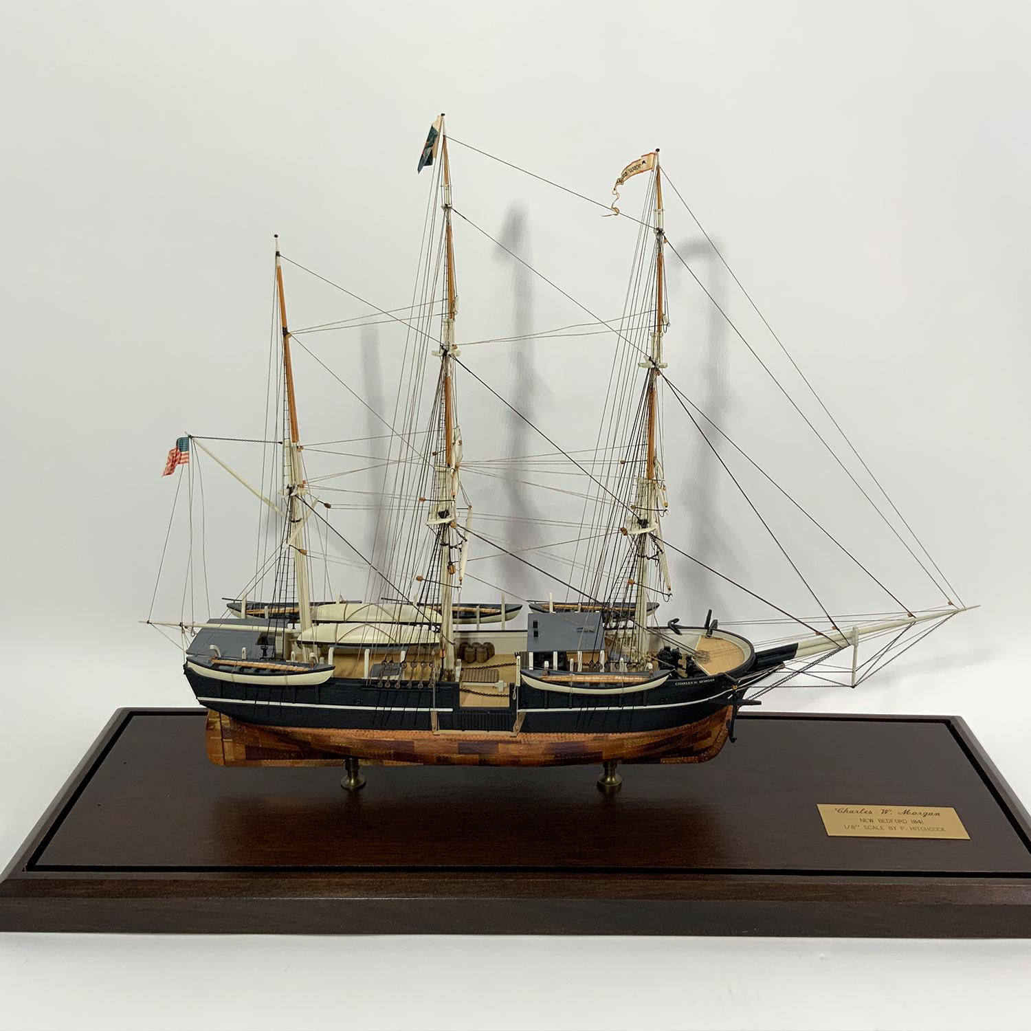 Quality model of the whaleship Charles W. Morgan by Paul Hitchcock. This Fine model has a copper sheathed hull, planked deck, built up bulwarks, etc. The vessel is fully rigged with all appropriate standing and running cords. Whaleboats hang from