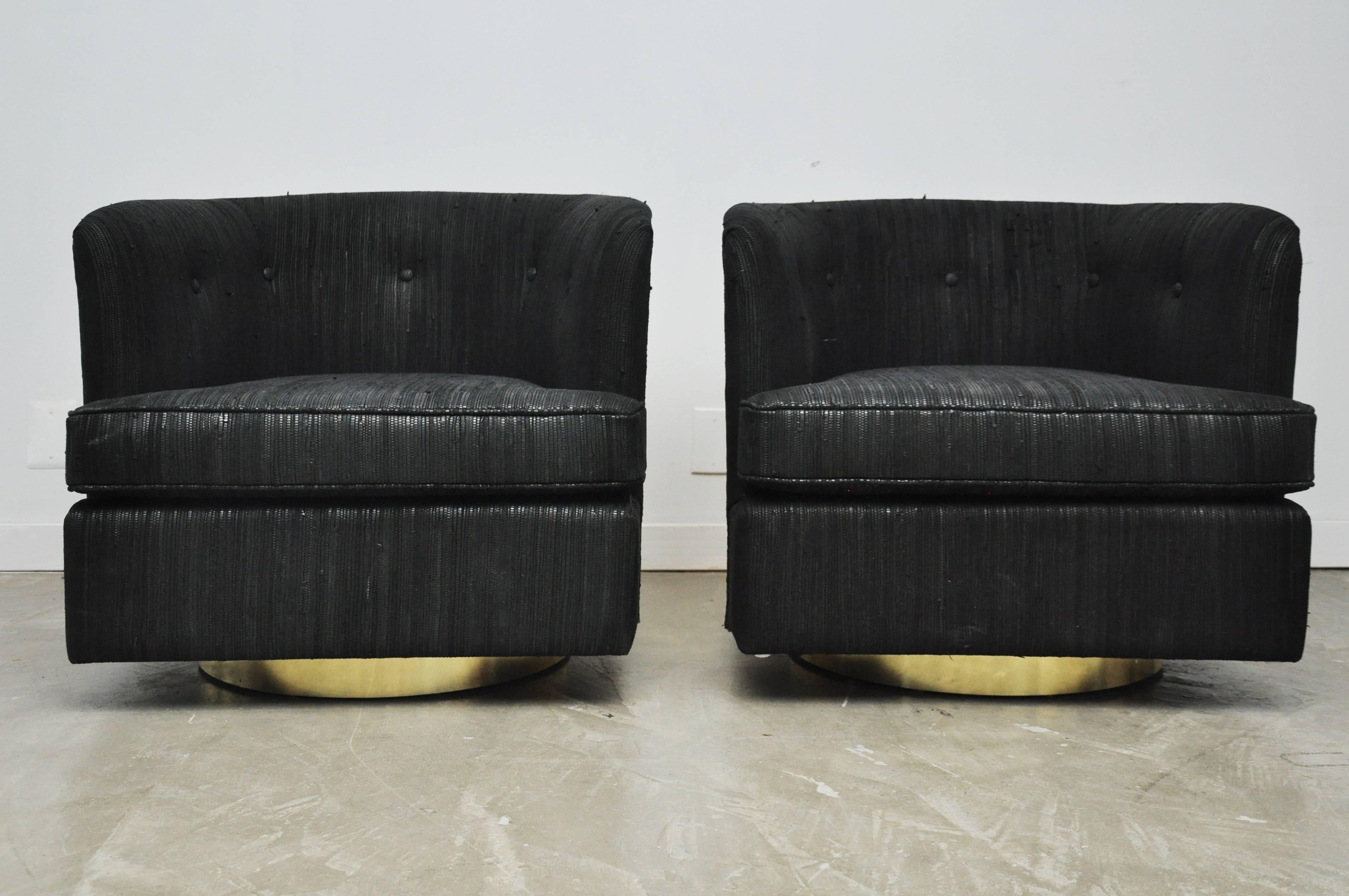 Milo Baughman swivel chairs with brass cases and woven black leather upholstery. Original brass backs show some signs of use, though good condition for age.