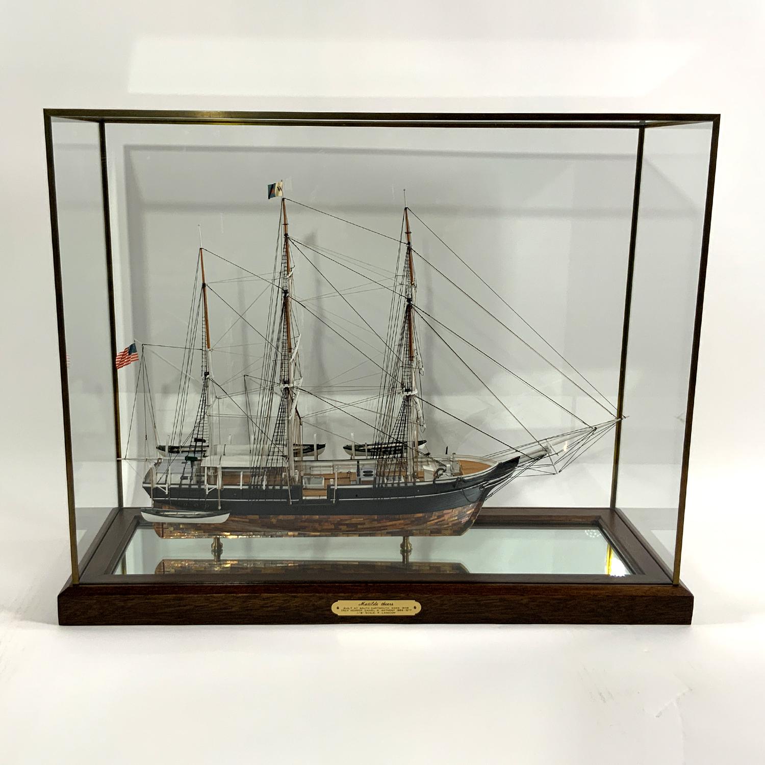 Whaleship model of the Matilda Sears. Built at Dartmouth, Massachusetts, launched in 1886. Very fine model with exposed ribs and planks on portside, painted and copper sheathed on starboard. The vessel carries six scale whaleboats, four completely