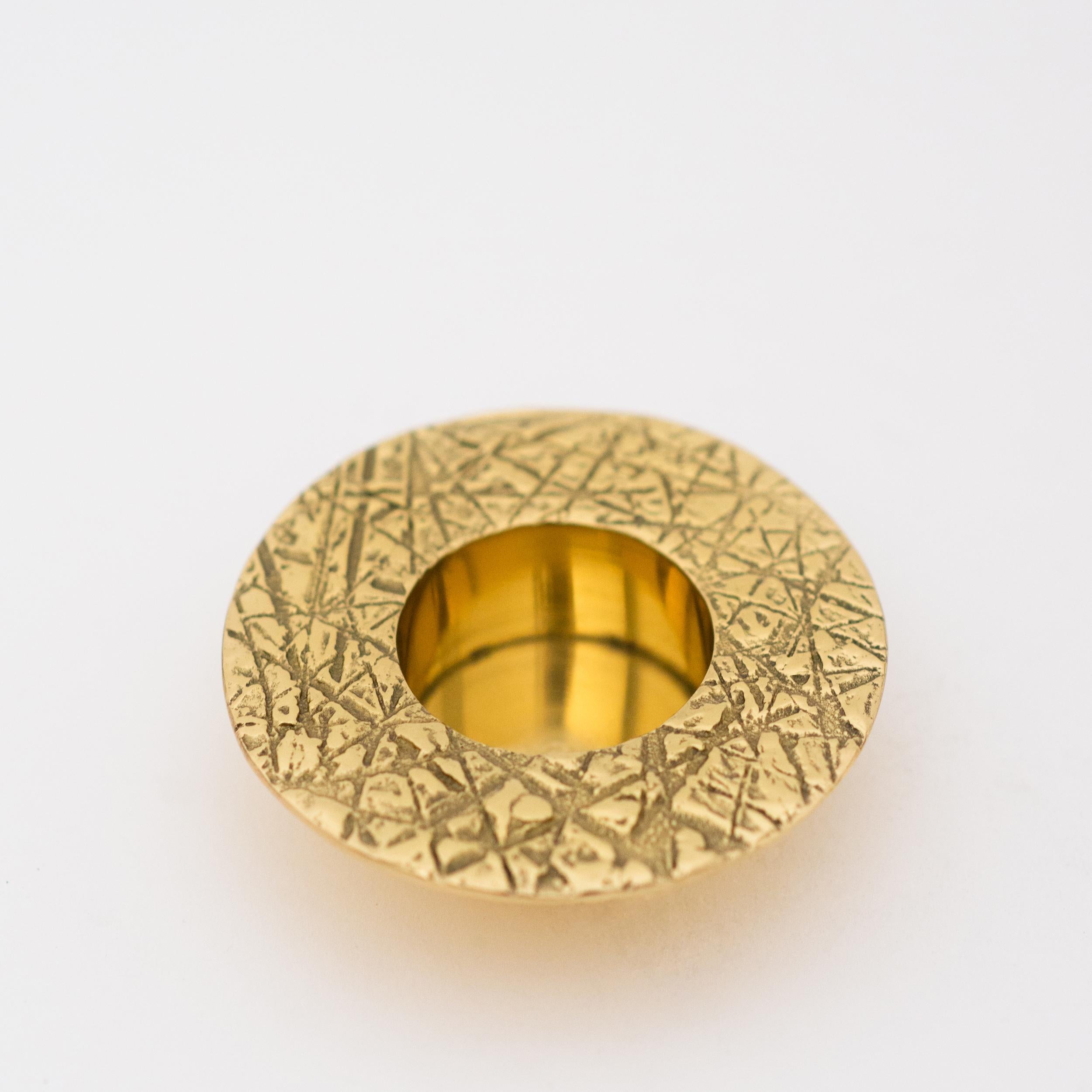 Each of those original brass tealight holders is handmade individually. Cast and textured using very traditional techniques, they are polished revealing the lustrous finish of this beautiful material.

Slight variations in the patina and polished