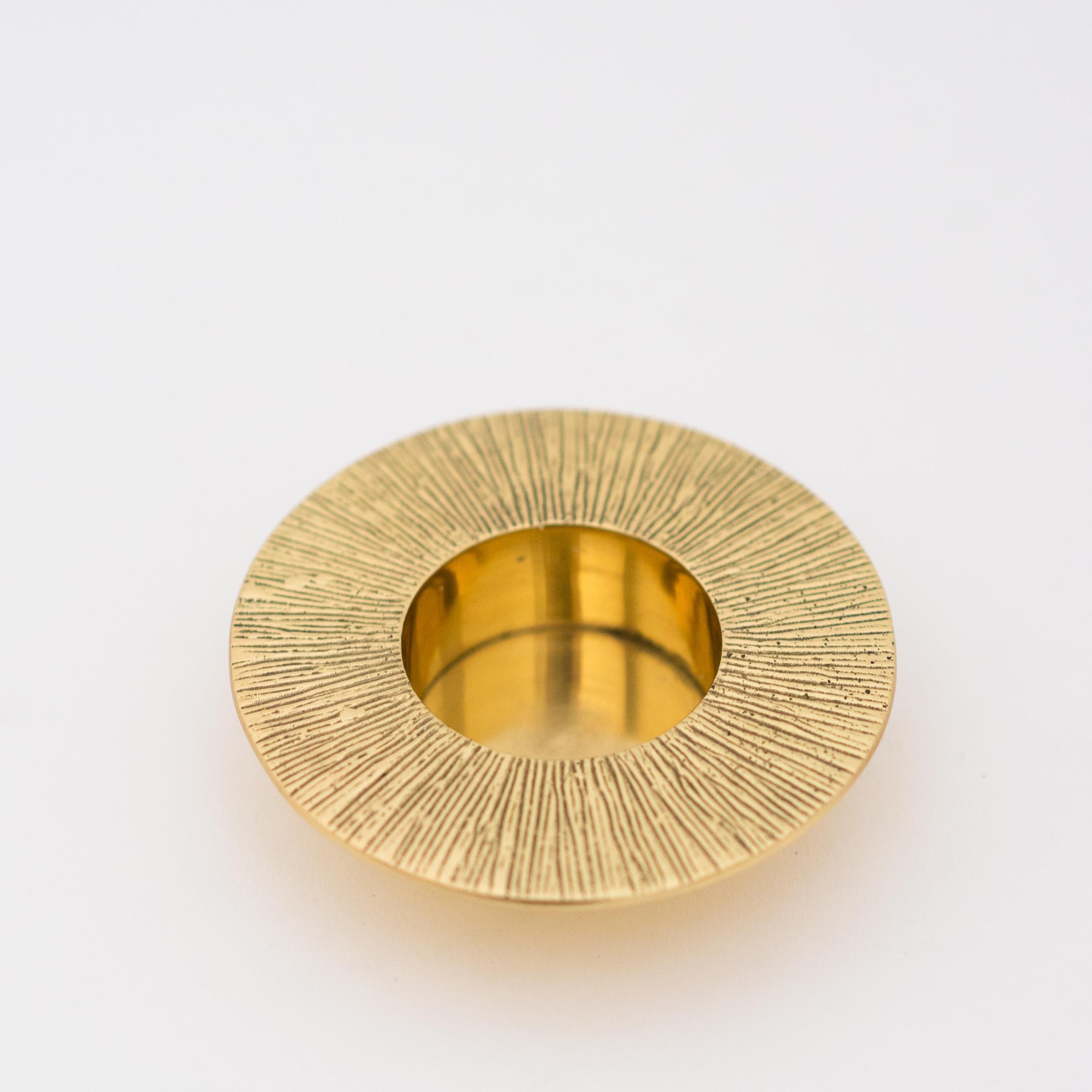 Each of those original brass tealight holders is handmade individually. Cast and textured using very traditional techniques, they are polished revealing the lustrous finish of this beautiful material.

Slight variations in the patina and polished
