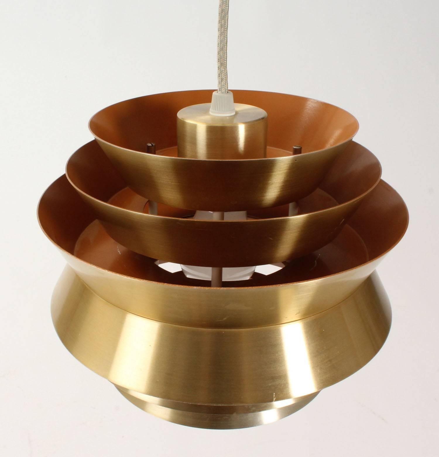Carl Thore for Granhaga circular brass ceiling lamp with orange inside, 1970s. Measures: H. 17. Ø 23 cm. Light wear.