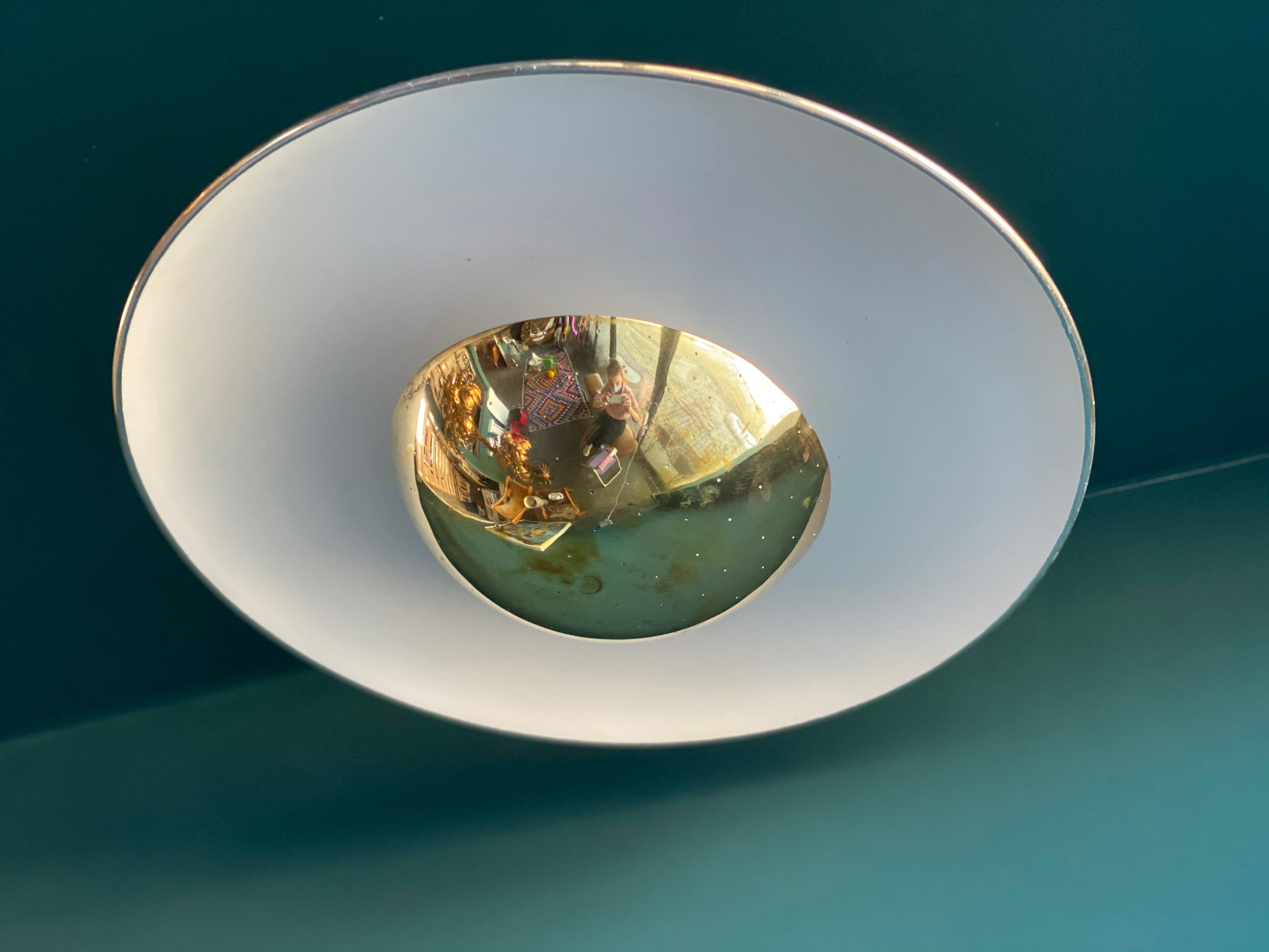 Rare ceiling lamp #155 by designer Gino Sarfatti for Arteluce from the 1950s. The aluminum reflector is painted white and decorated with a brass rim. Under the brass shade with small holes there are three E27 sockets, which provide a very nice