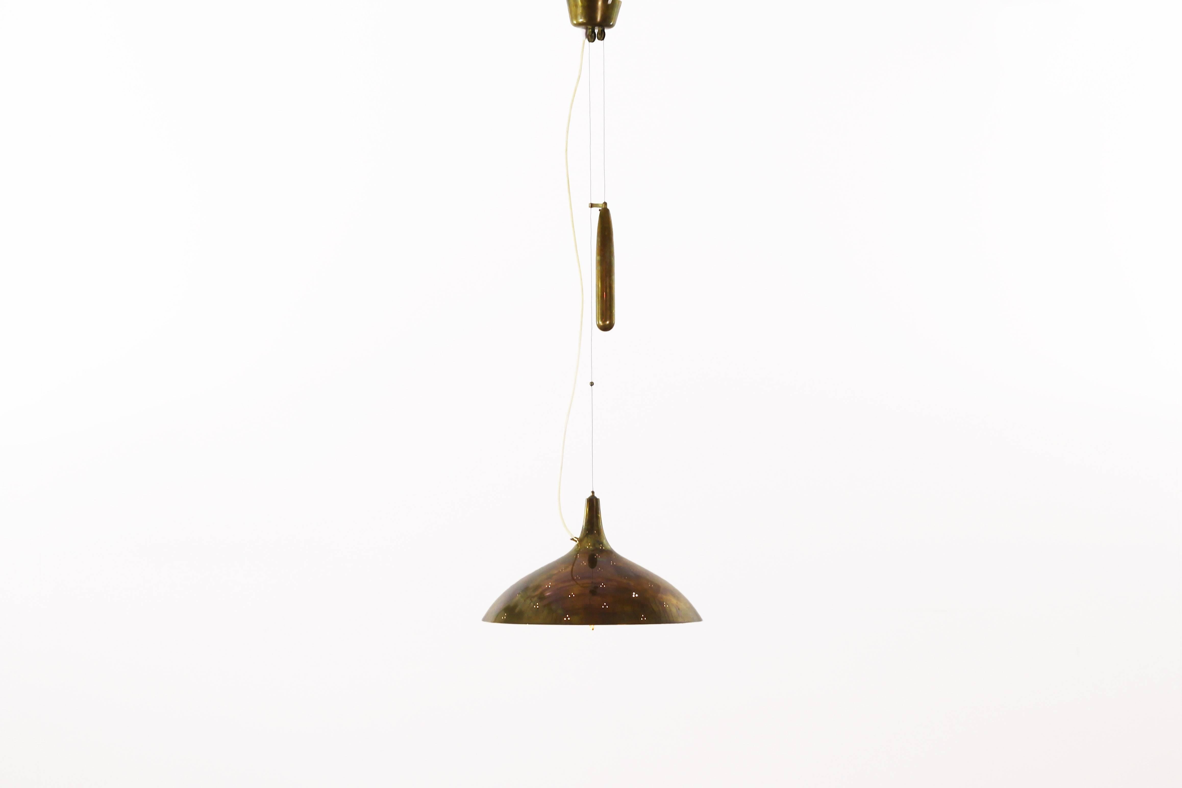 Very beautiful ceiling lamp designed by Paavo Tynell for Taito Oy, Finland in the late 1940s.
The lamp is made of brass and comes with a great patinated condition without any damages. The electric still works and is original.