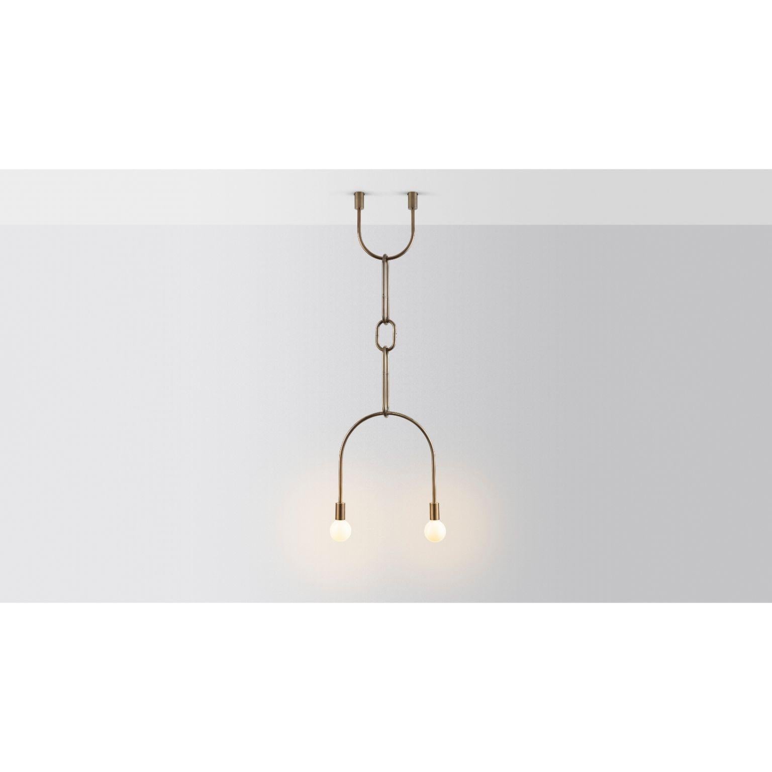 Brass chain on U by Volker Haug
Dimensions: 49.5 x H minimum 108 cm
Materials: Brass
Finish: Raw, satin lacquer
Weight: approx 4kg

Lamp: E27, Frosted or Opal LED G95 or G125
  

The U Chain series hangs with gravity and a sense of