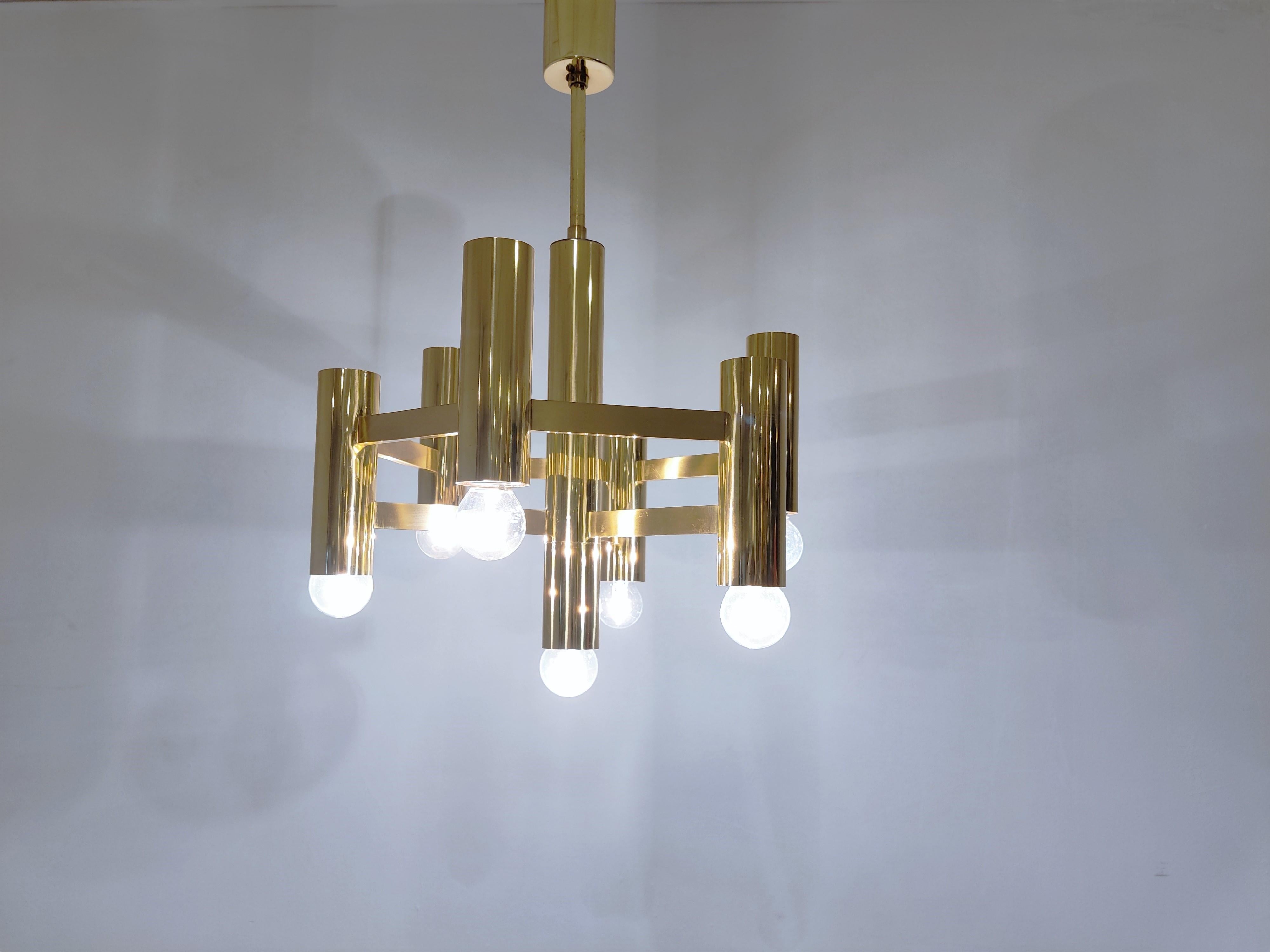 Tubular brass Gaetano Sciolari chandelier with 7 lightpoints.

Produced by Boulanger SA in Belgium

The chandelier is in very good condition and in full working order.

Tested and ready for use, chandelier will work all around the