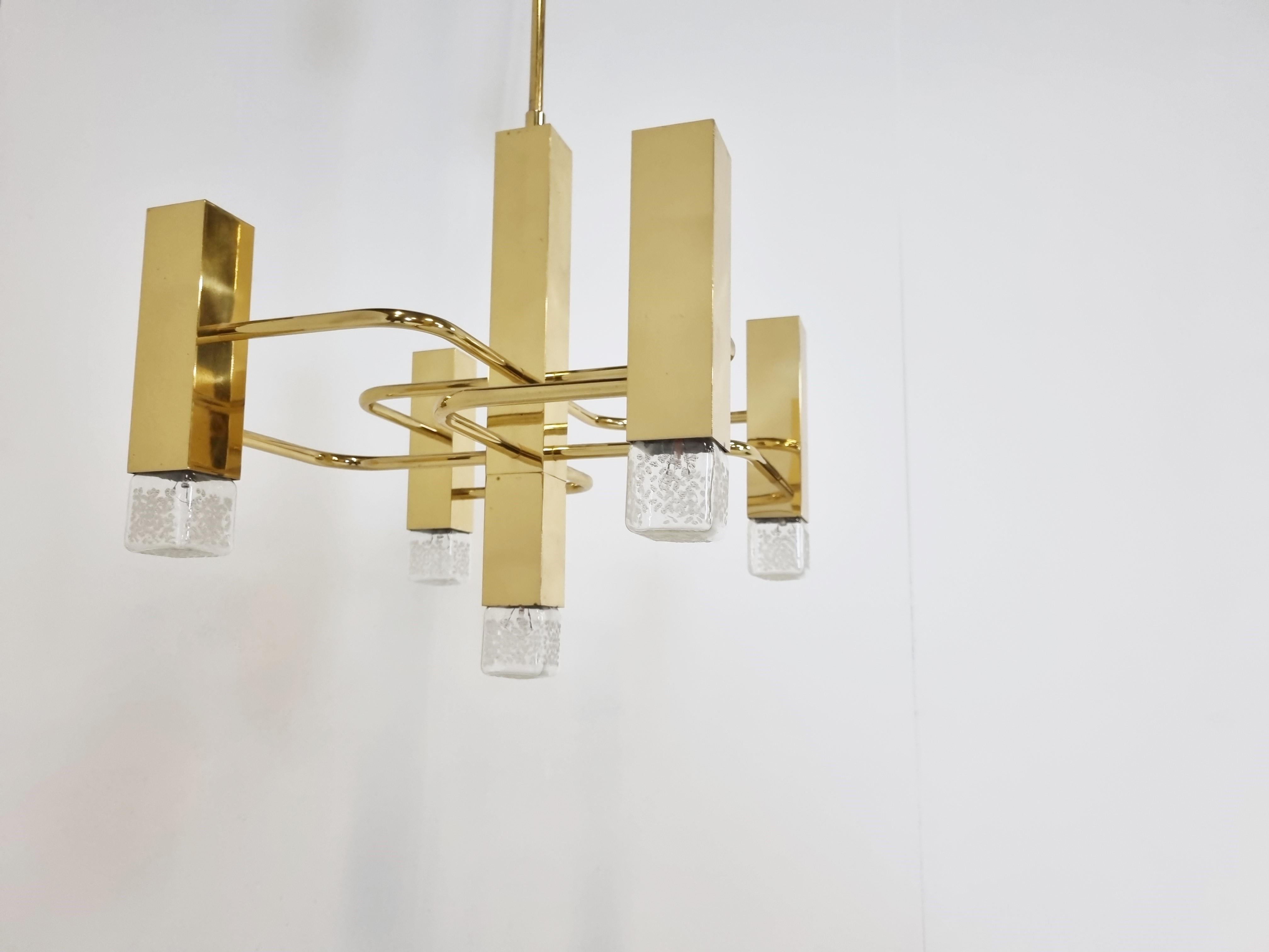 Cubic brass Gaetano Sciolari chandelier with 5 lightpoints.

Produced by Boulanger SA in Belgium

The chandelier is in very good condition and in full working order.

Tested and ready for use, chandelier will work all around the world

1970s