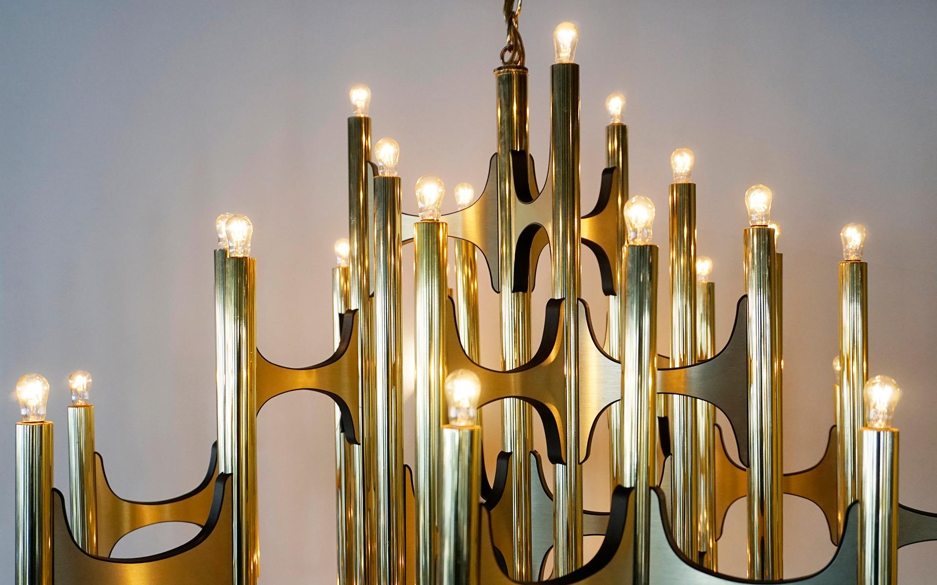 Fifty four light brass chandelier designed by Gaetano Sciolari for Lightolier. The largest, most rare version of this design. New light bulbs exactly like the originals. All sockets work and in great condition. This stunning light fixture is ready
