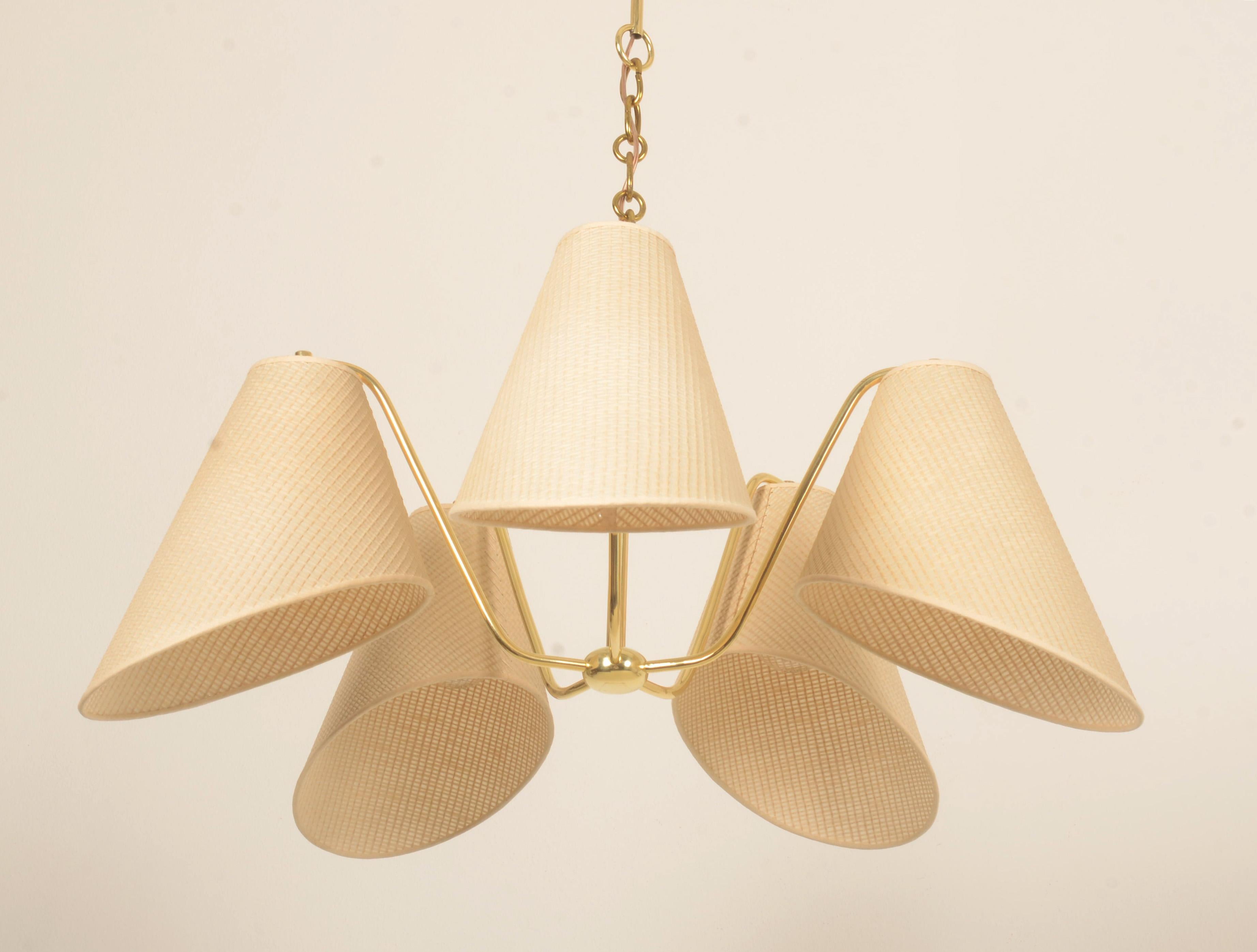 Brass frame with five arms fitted with E27 sockets each with shades. Designed by Josef Frank in the 1930s for J.T. Kalmar produced in the 1940s. 
The chandelier is fully restored with new european wire, sockets and original shades. The total height