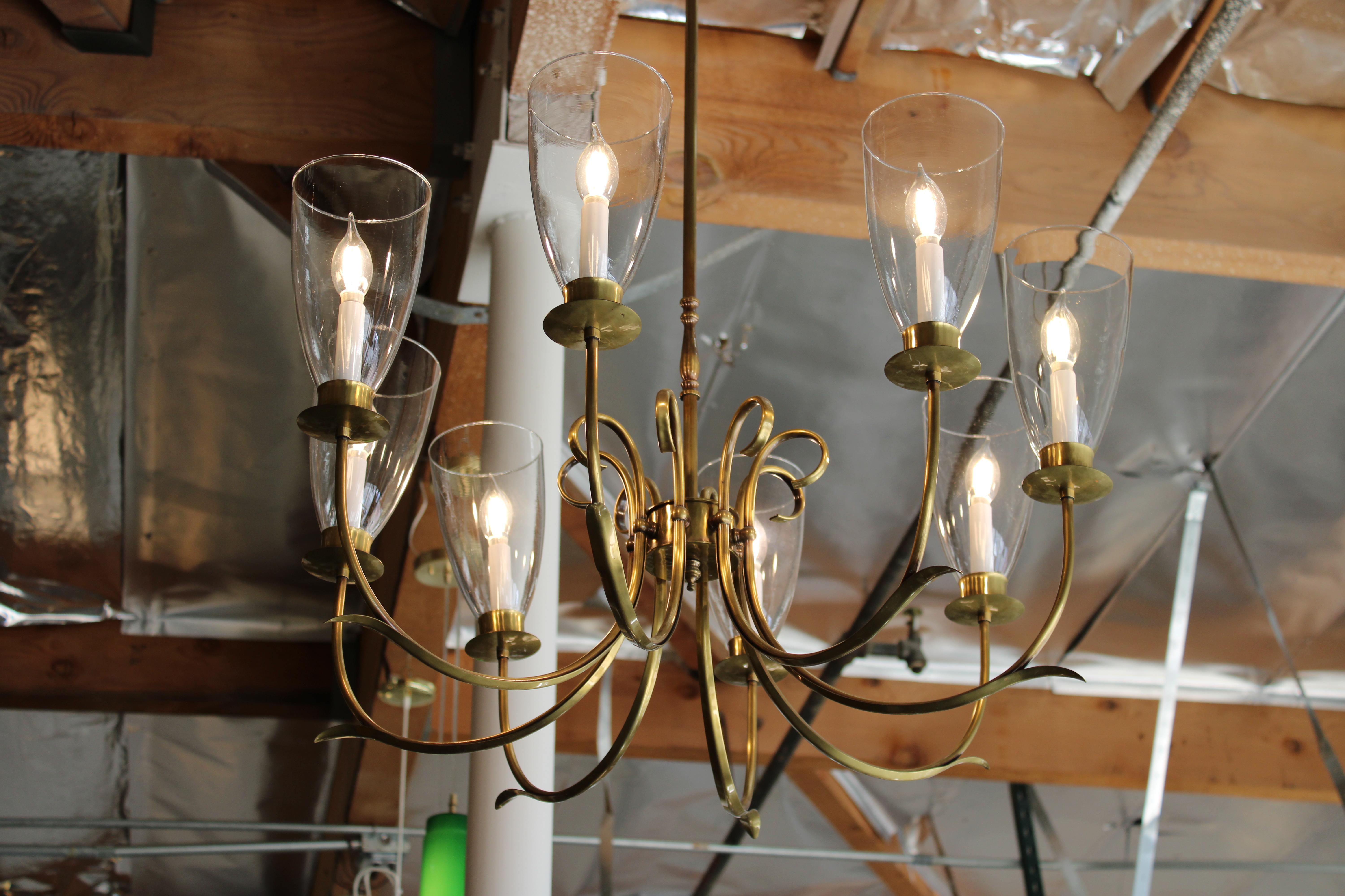 Brass chandelier by Norman Grag made in Manton, California. Chandelier measures 36