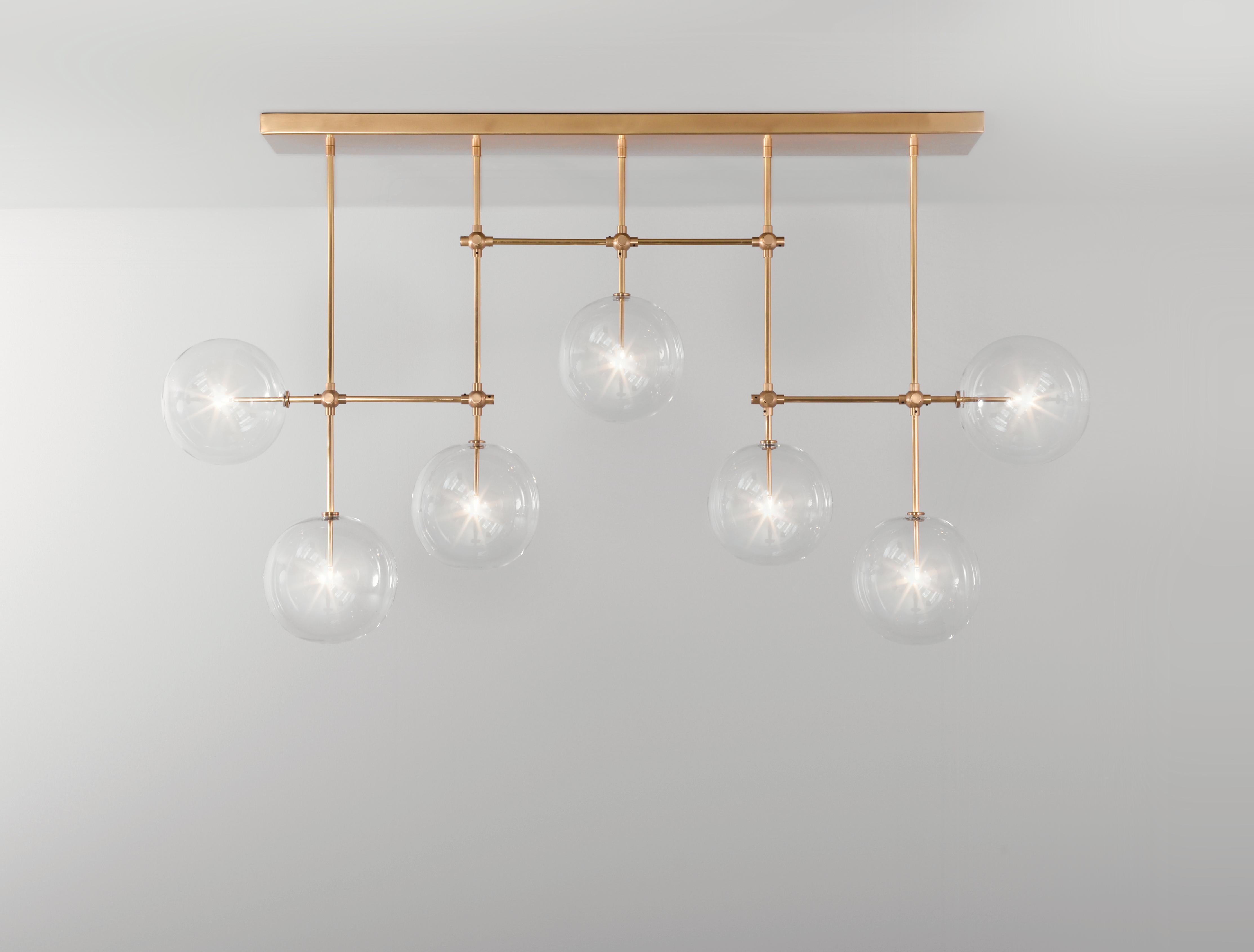 Soap B7 MD Brass chandelier by Schwung
Dimensions: W 150 x D 23 x H 83.4 cm
Materials: Solid brass, hand blown glass globes

Max wattage: 1.6W
Bulb base: G4, 12V AC
Lumens: 600lm
Colour temperature: 2700k
Maximum bulb diameter: 10mm
Also available