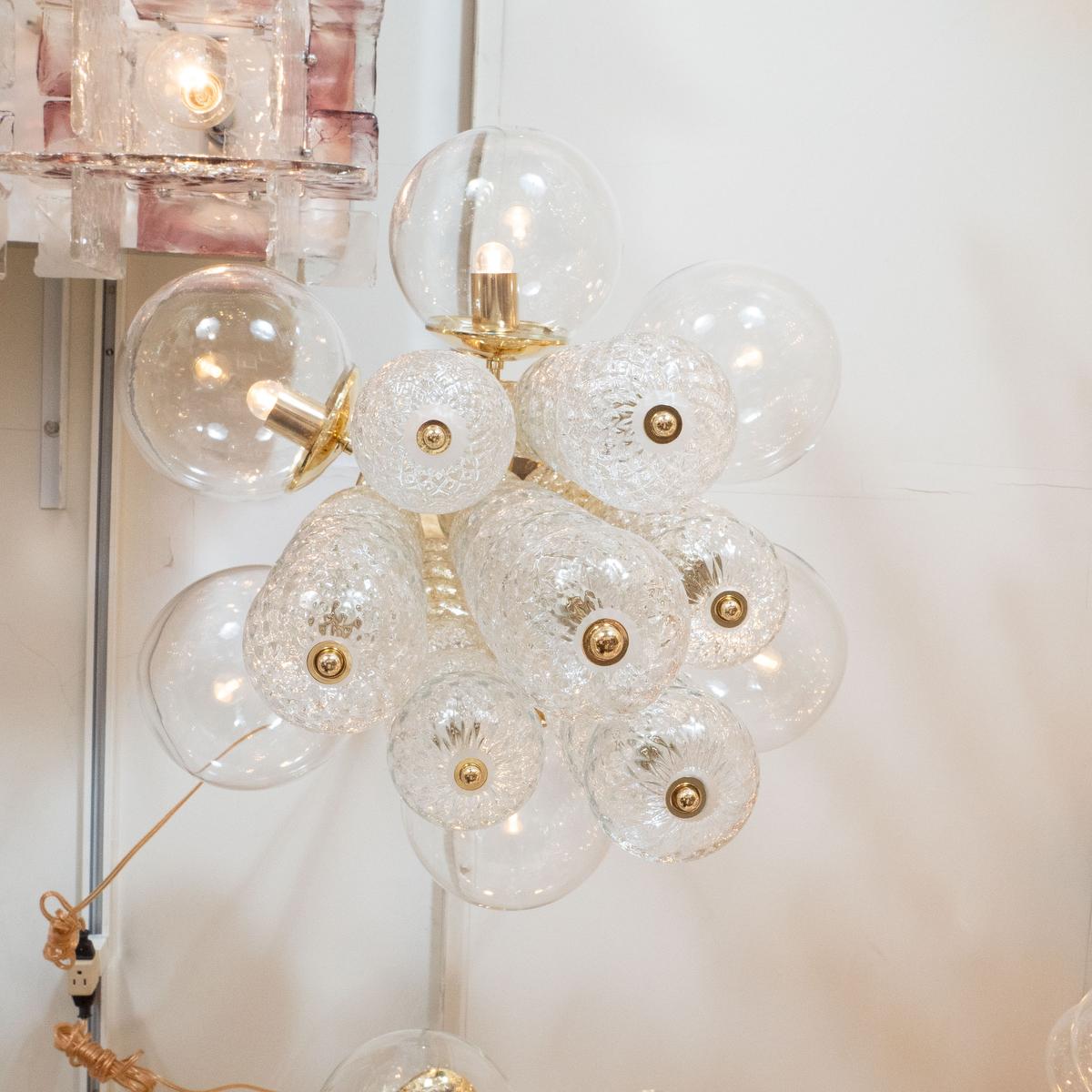 Austrian Brass Chandelier Composed of Multiple Clear and Textured Glass Ball Elements For Sale