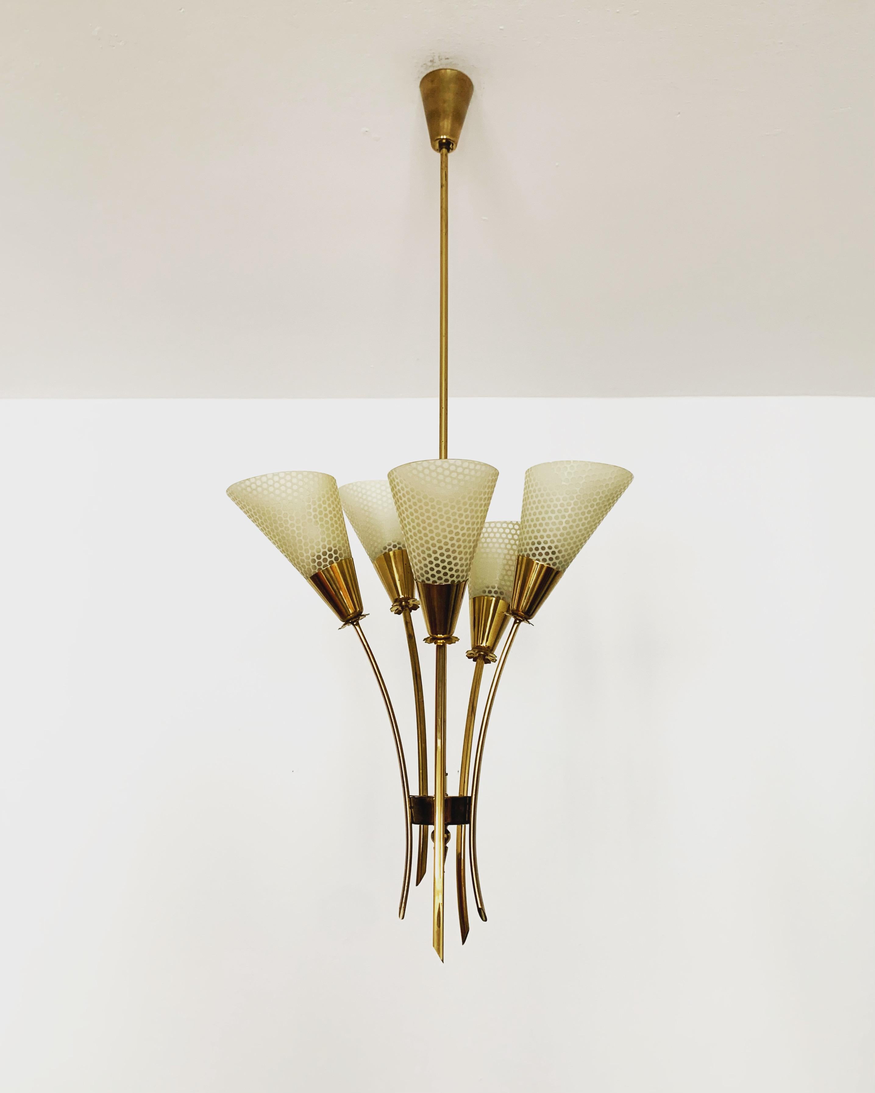 Exceptionally beautiful and stylish Italian chandelier from the 1950s.
Wonderful design and an asset to any home.
Very nice glass lampshades with a great pattern.

Condition:

Very good vintage condition with slight signs of wear consistent with