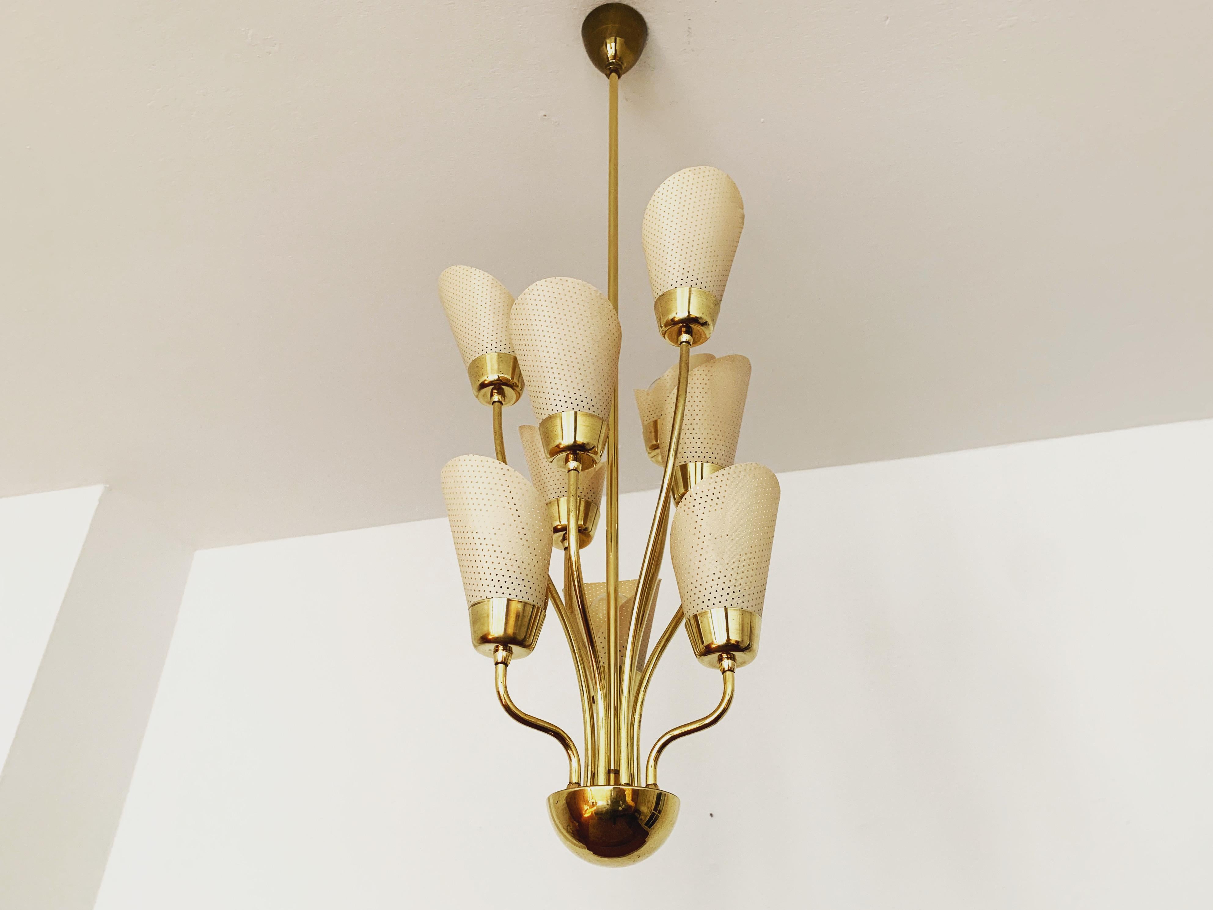 Exceptionally beautiful and stylish chandelier from the 1950s.
Very decorative and of high quality.
Wonderful design and an asset to any home.

Condition:

Very good vintage condition with slight signs of wear consistent with age.
The brass