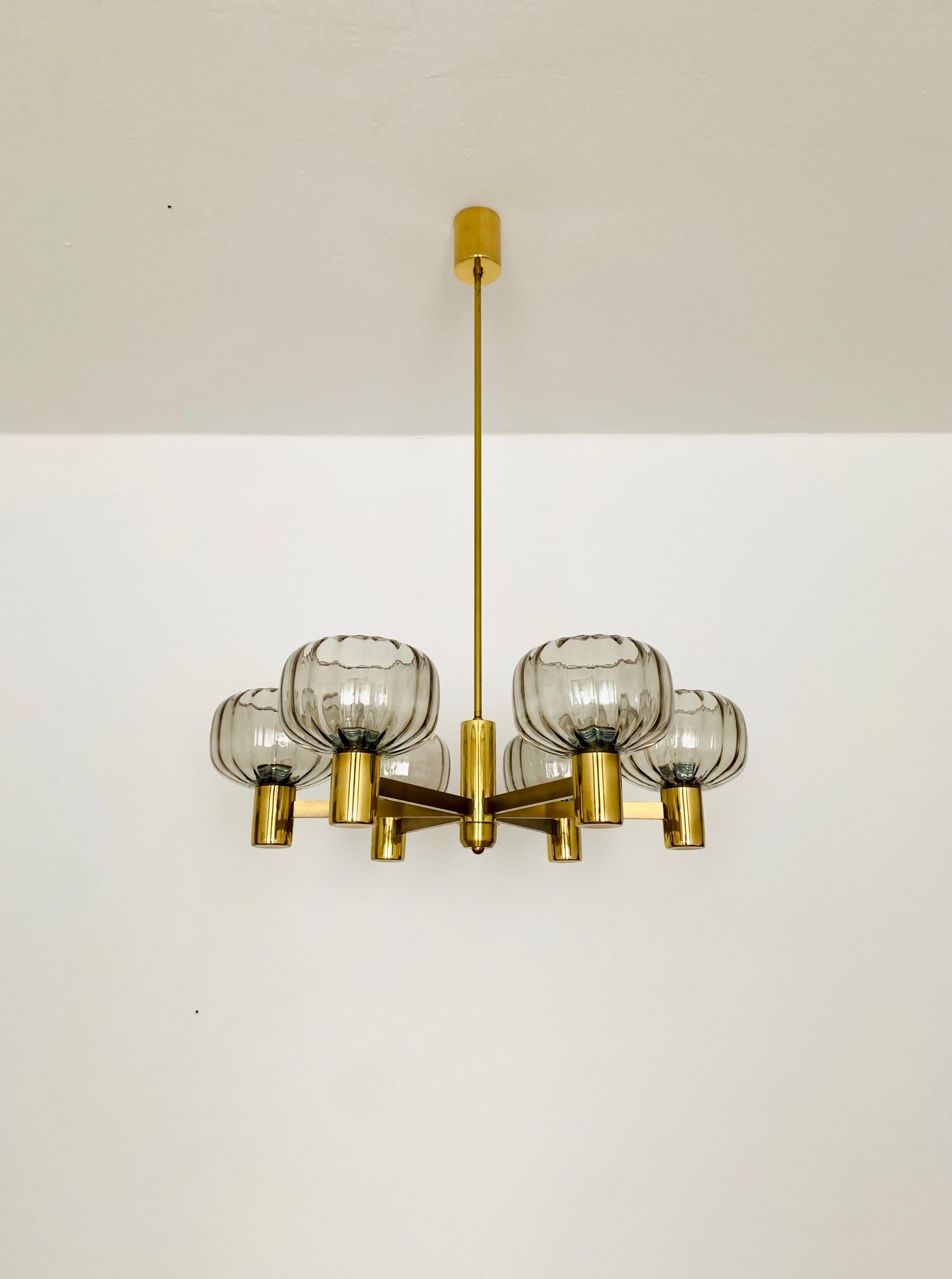 Very nice chandelier from the 1960s.
The 6 lampshades spread a spectacular light.
The lamp is manufactured to a very high quality.
Very contemporary design with a fantastic, elegant look.

Condition:

Very good vintage condition with slight signs of