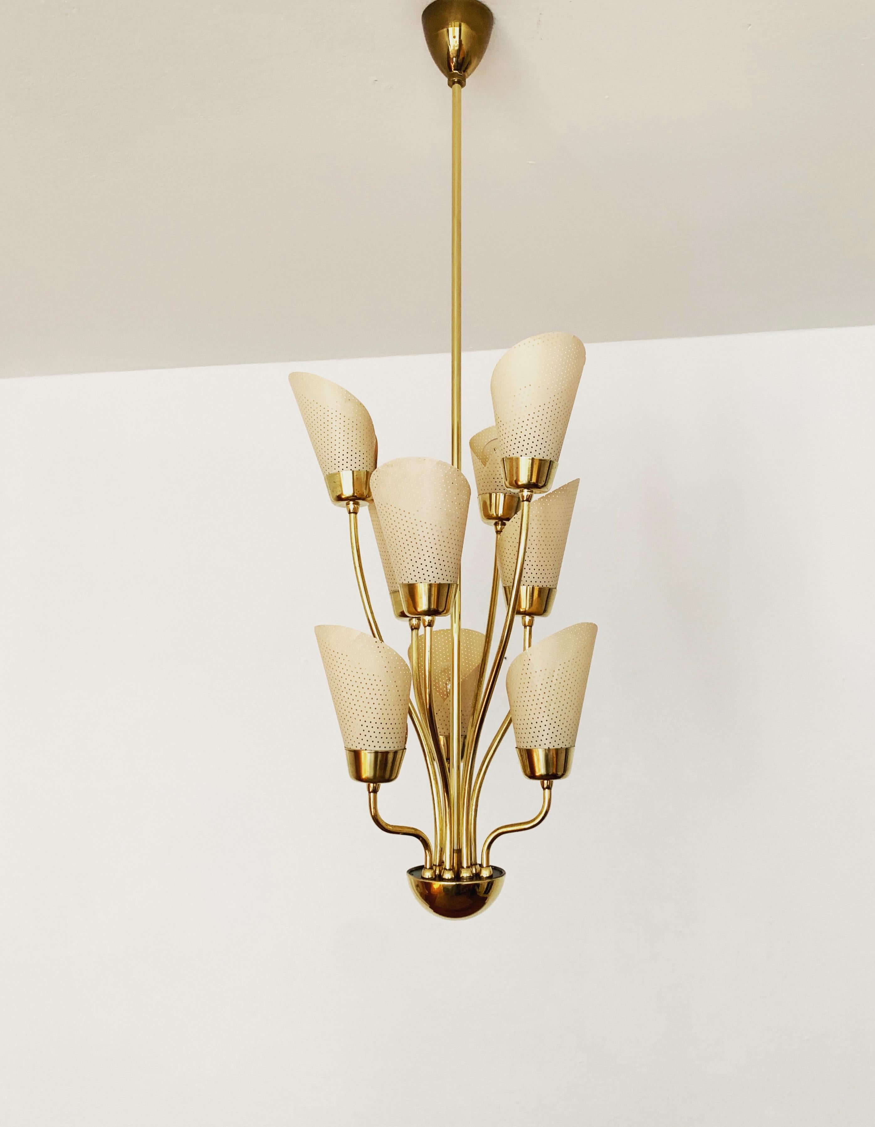 Exceptionally beautiful and stylish chandelier from the 1950s.
Very decorative and of high quality.
Wonderful design and an asset to any home.

Condition:

Very good vintage condition with slight signs of wear consistent with age.
The brass parts