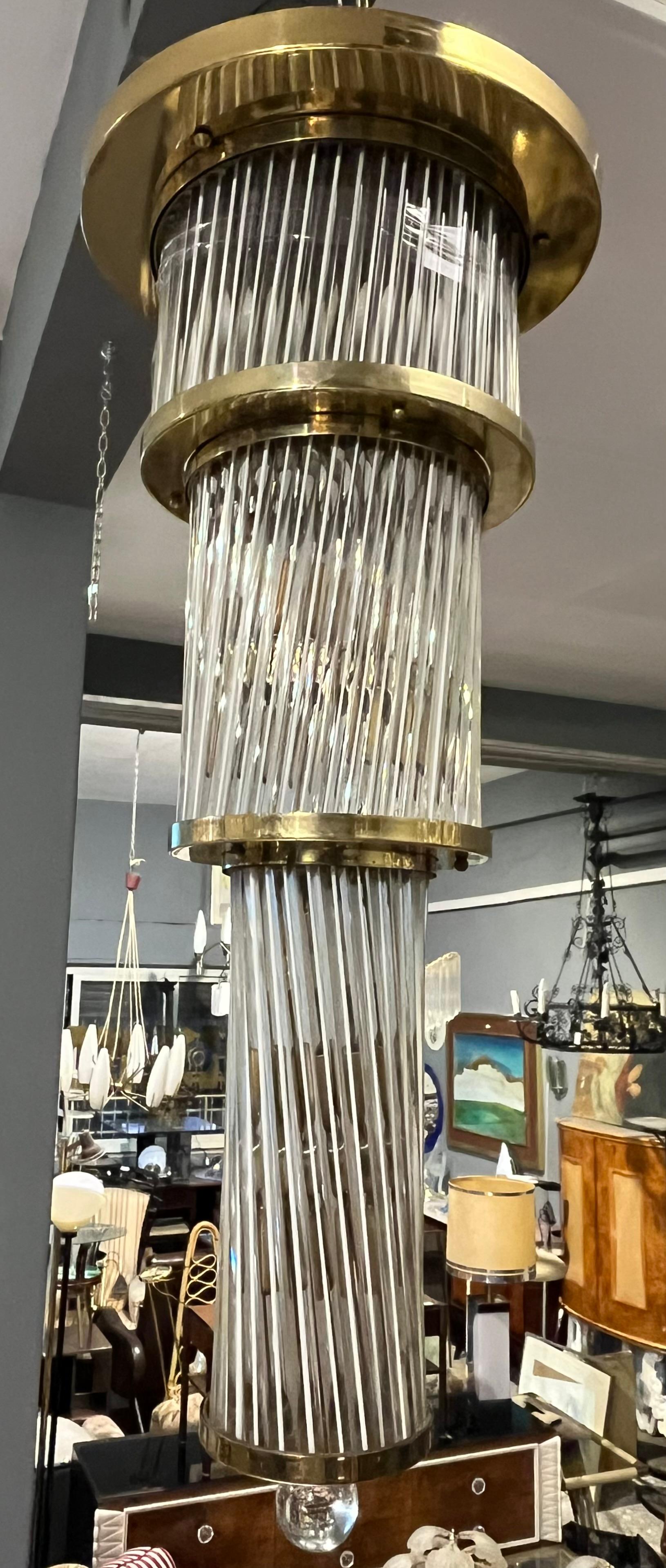 Brass chandelier from the 1960s attributed to the famous Venini glass factory. Product in good condition with small wear caused by years and use. Please review the attached images carefully. The history of the company began in 1921, when the