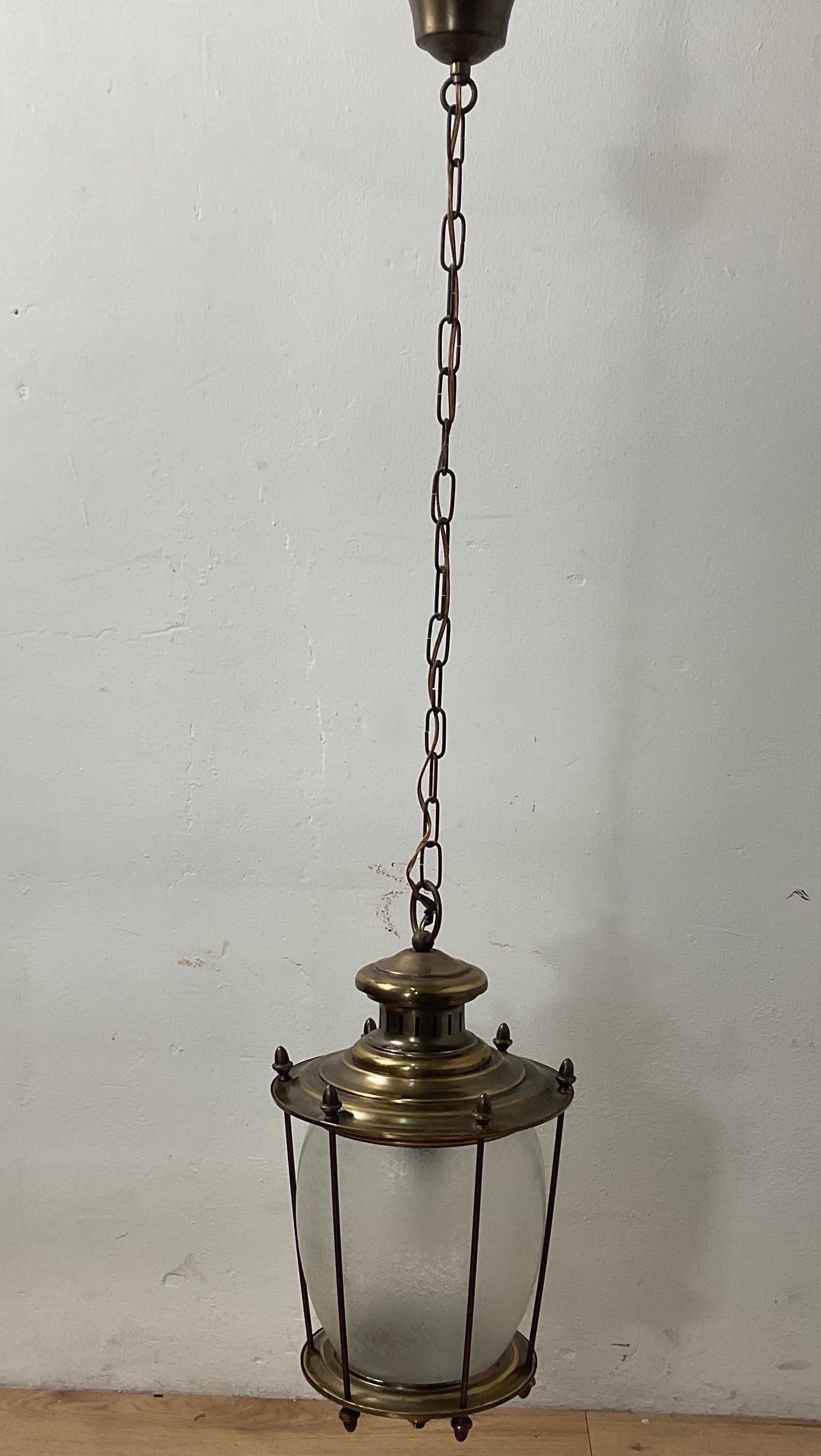 Brass chandelier from the 50s by Lumi Milano in good condition. Brass frame with glass
